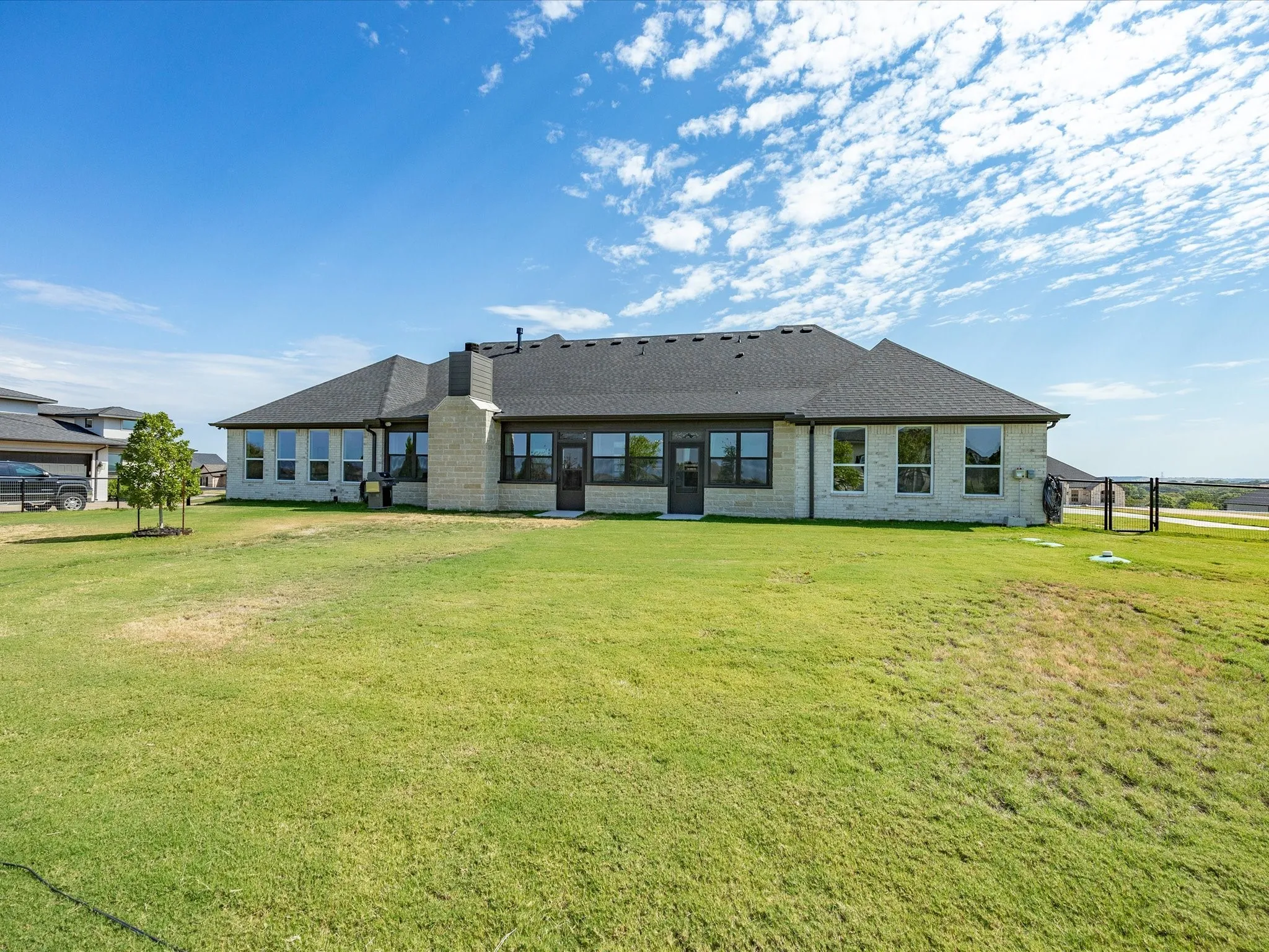This property offers an abundance of opportunity to create your dream outdoor space for enjoy the open grass space.