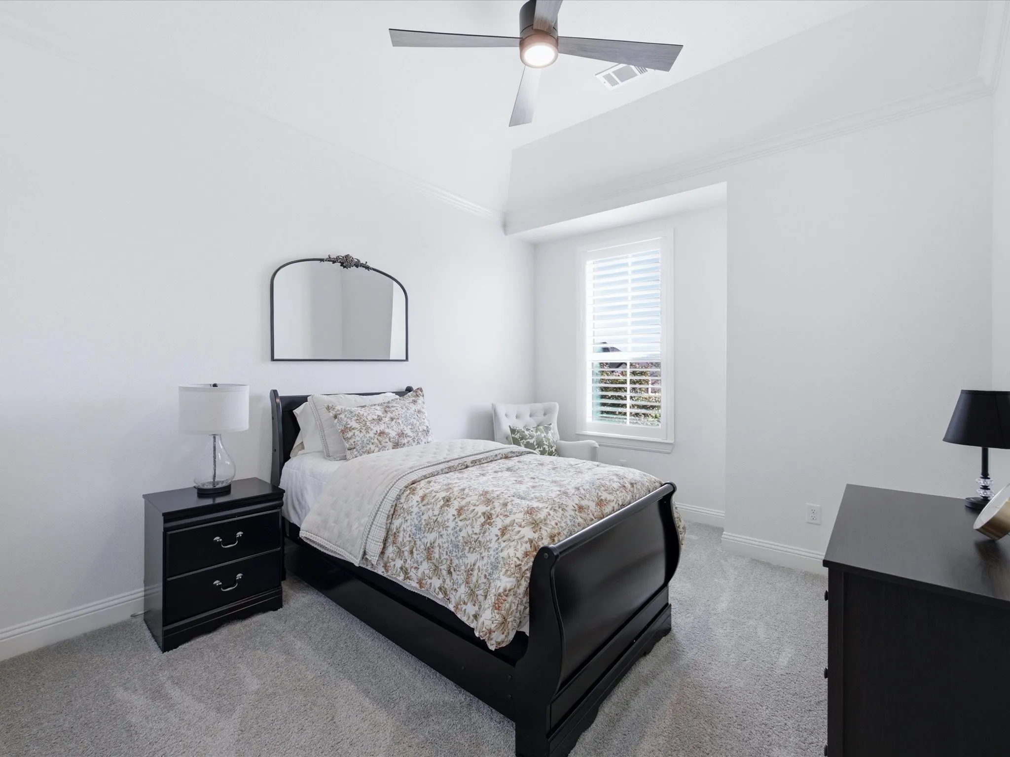 Inviting guest bedroom with a bright, airy feel and plenty of space to comfortably accommodate family or overnight guests.