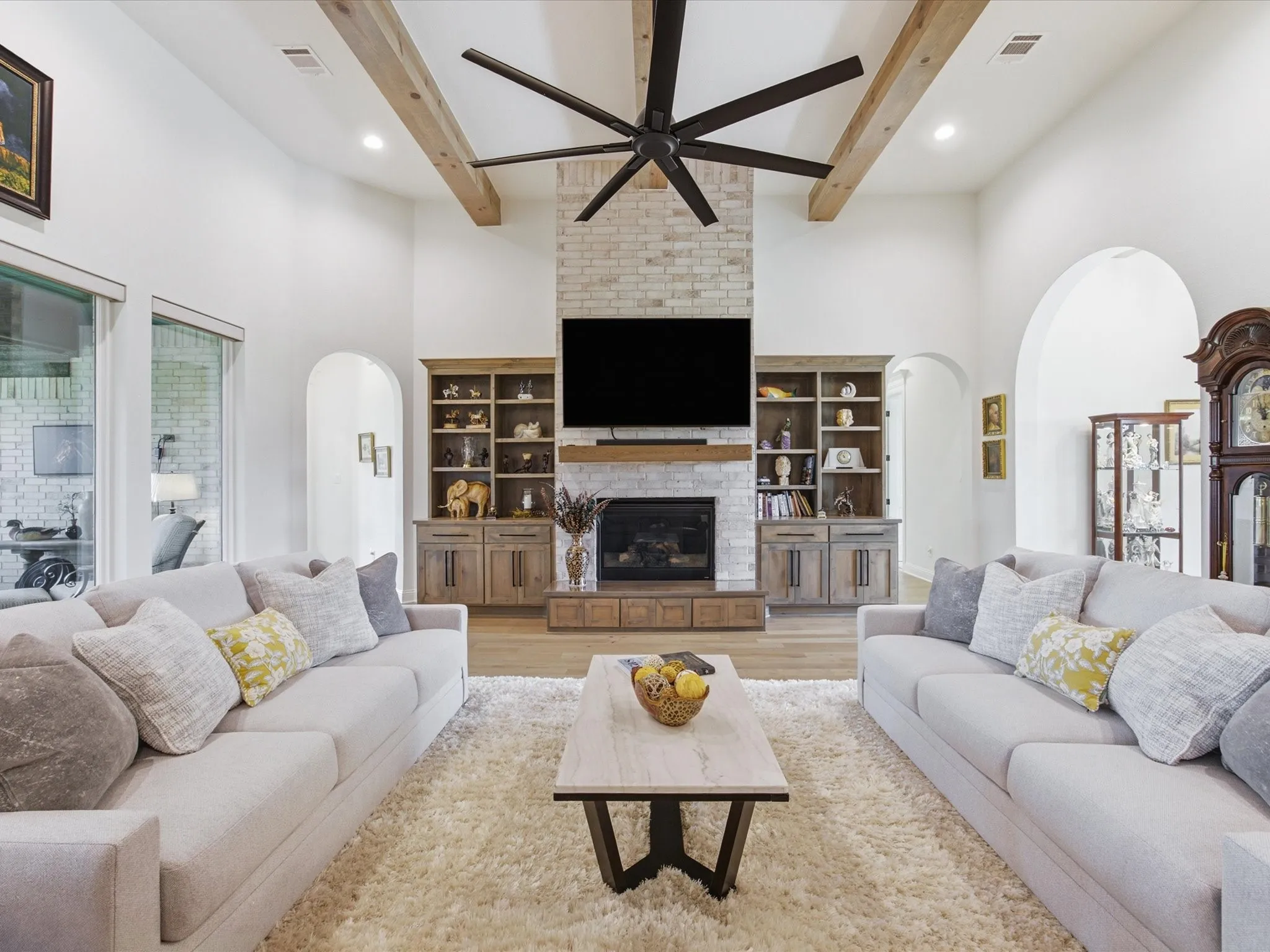 Built-in cabinets flanking the cozy gas fireplace.