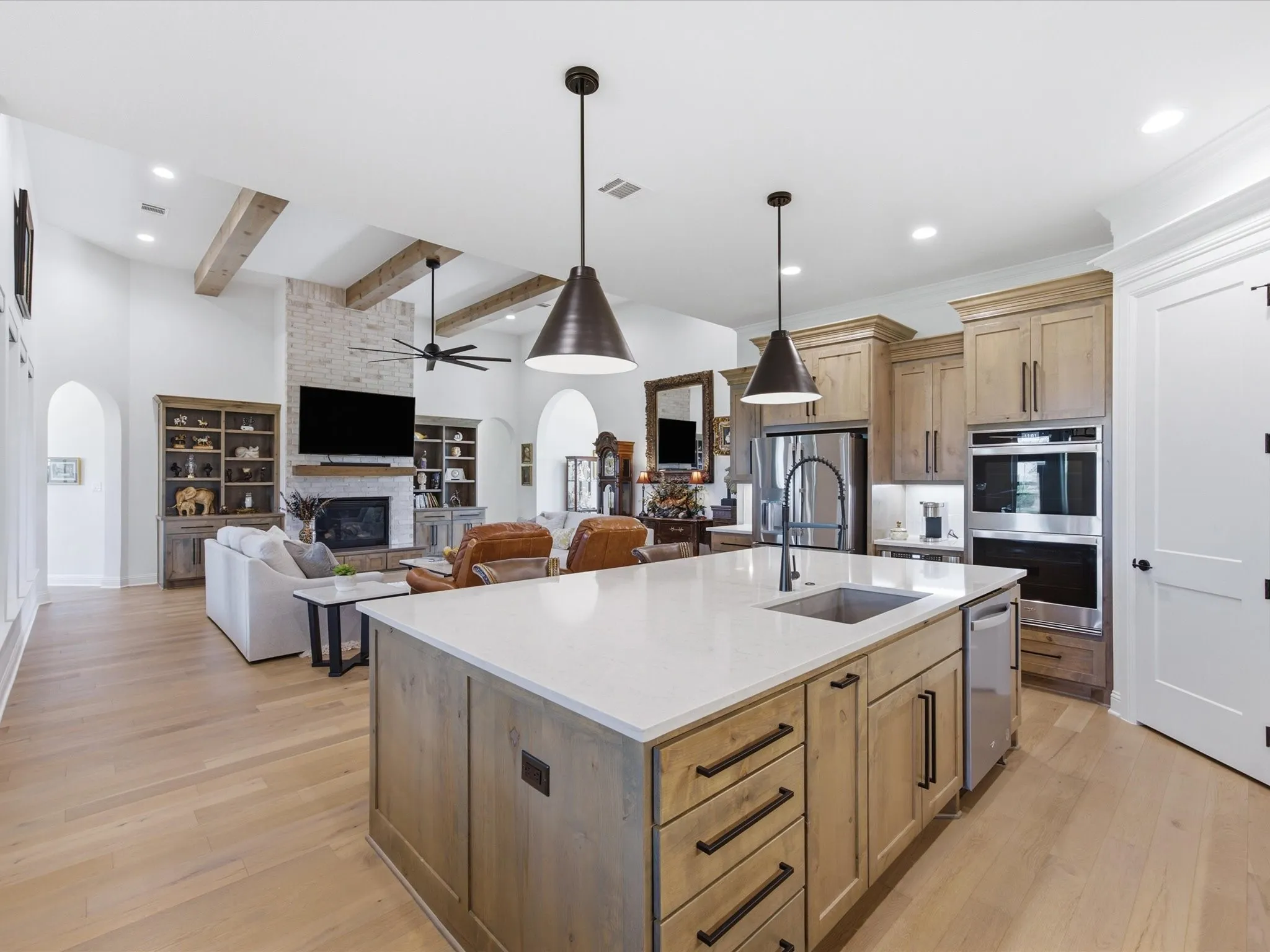Seamless sight-lines from the kitchen into the living room create the perfect space for entertaining.