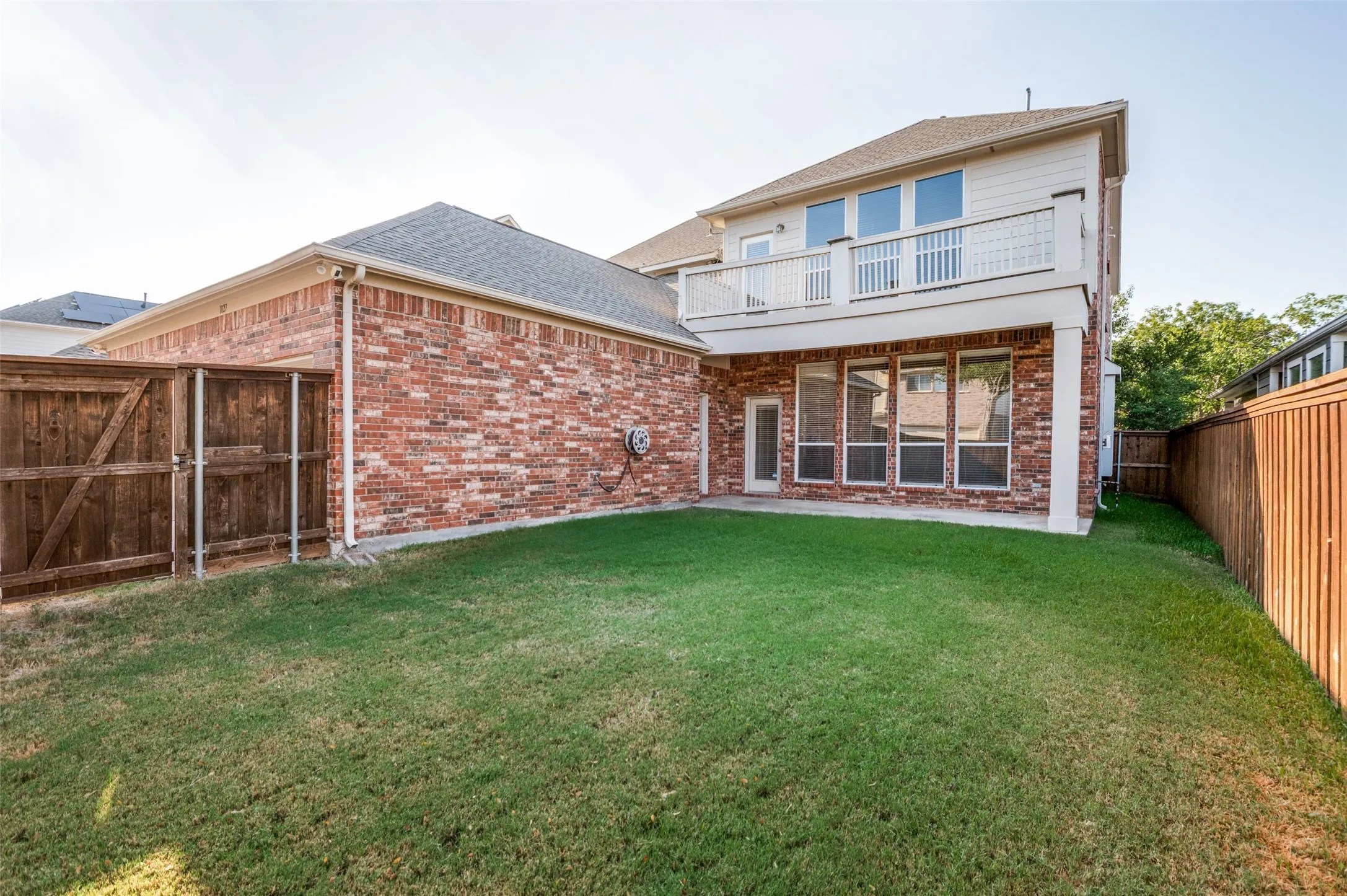 Spacious yard with 2nd floor balcony