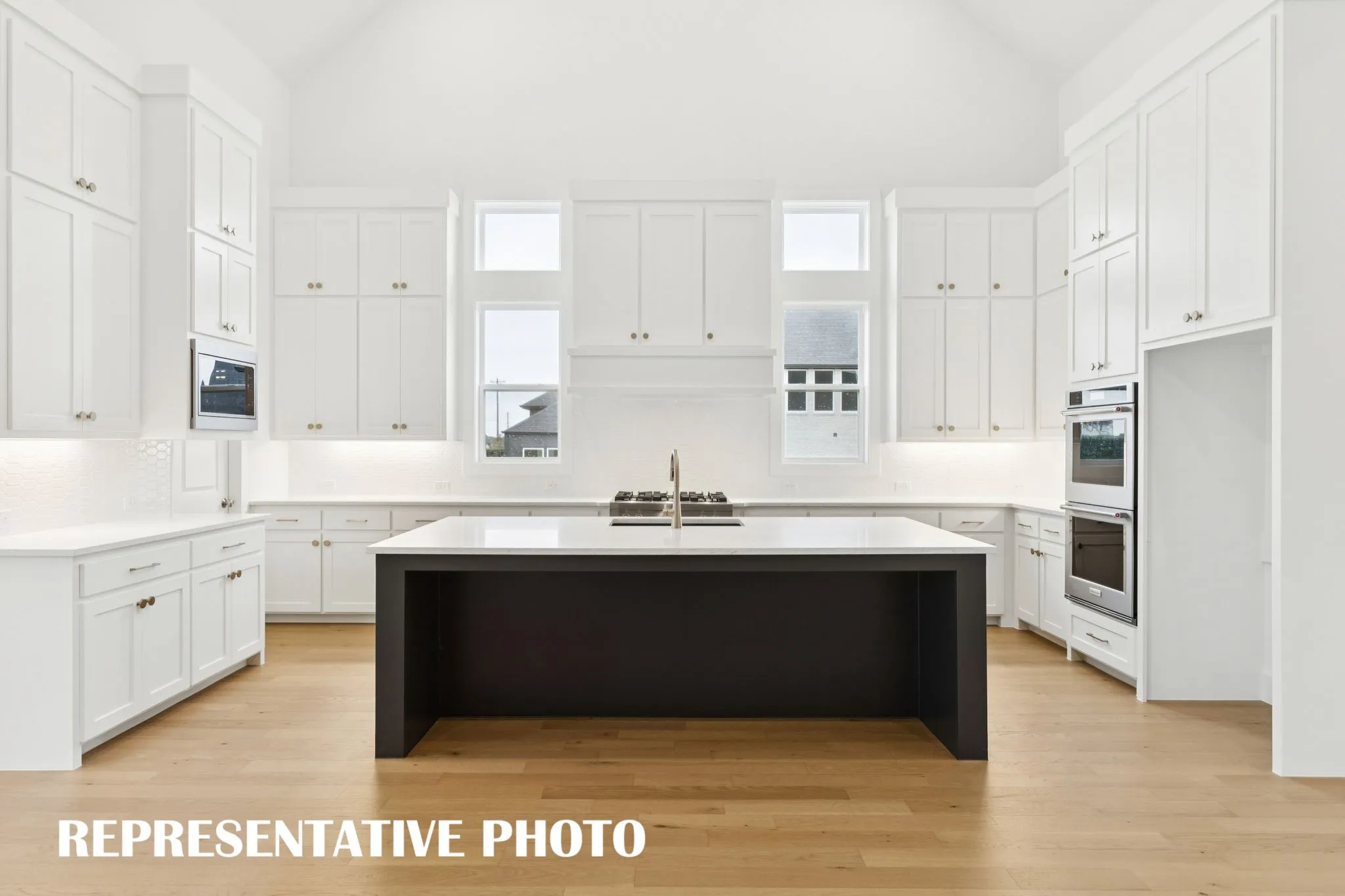The bold and beautiful chef's kitchen in our Reese plan will satisfy all the chef's in the family!  REPRESENTATIVE PHOTO
