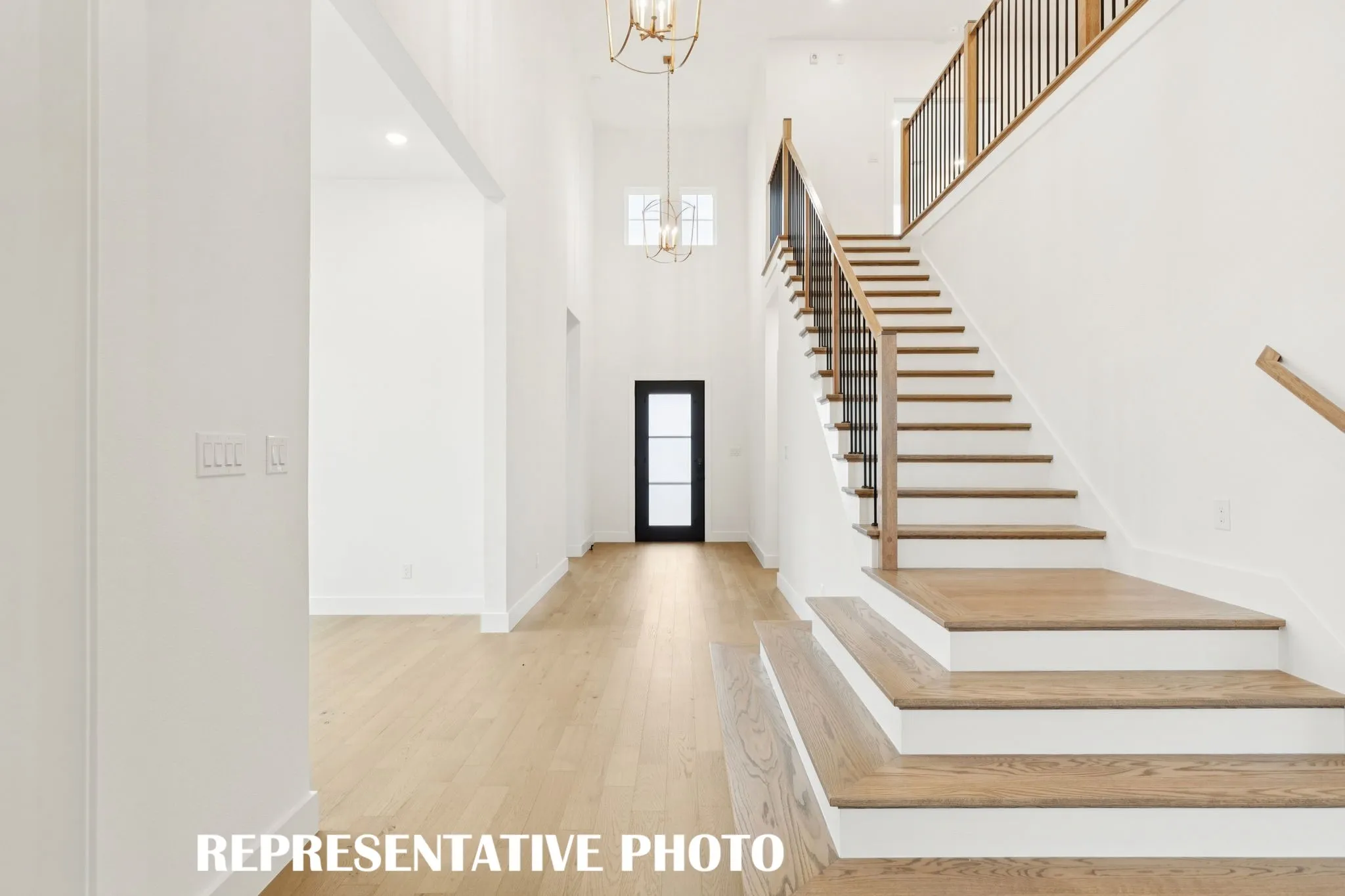 Featuring a grand entrance with dramatic stair case, our Reese floor plan is your forever home come to life!  REPRESENTATIVE PHOTO