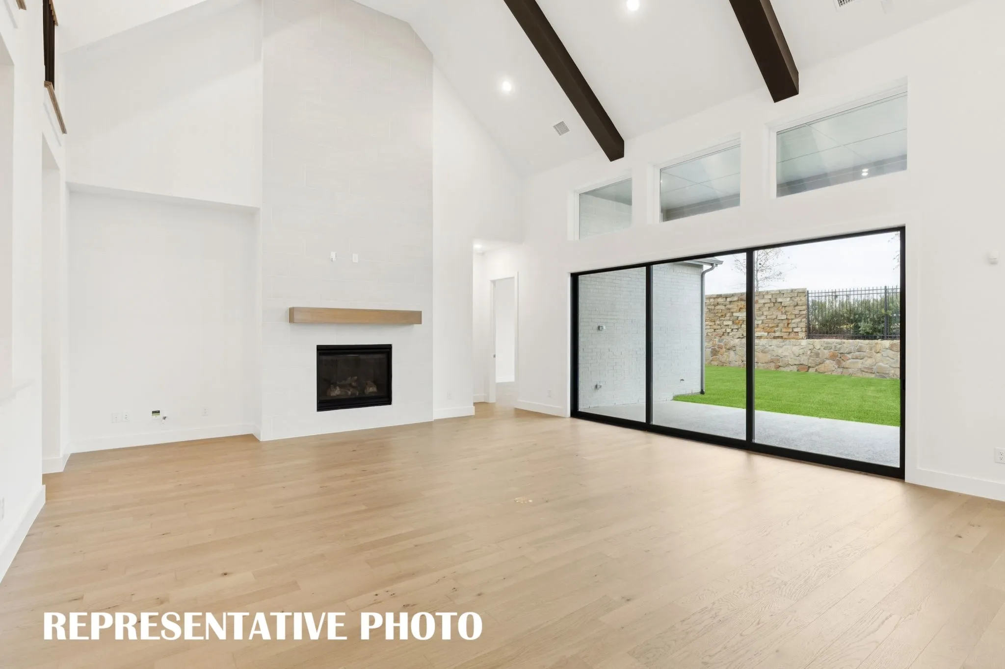Featuring a full wall slider, it's easy to take the party outdoors in this dream home!  REPRESENTATIVE PHOTO