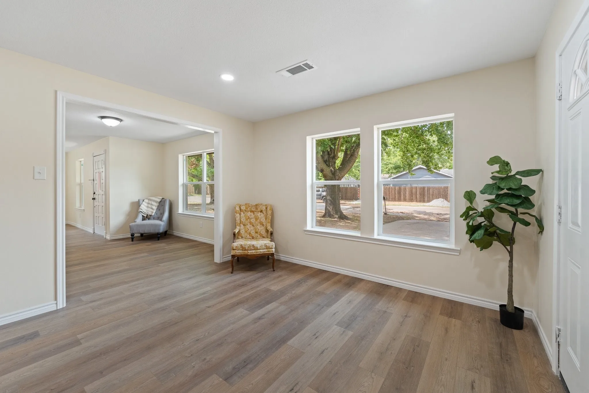 Light-toned walls complement wood-finish flooring