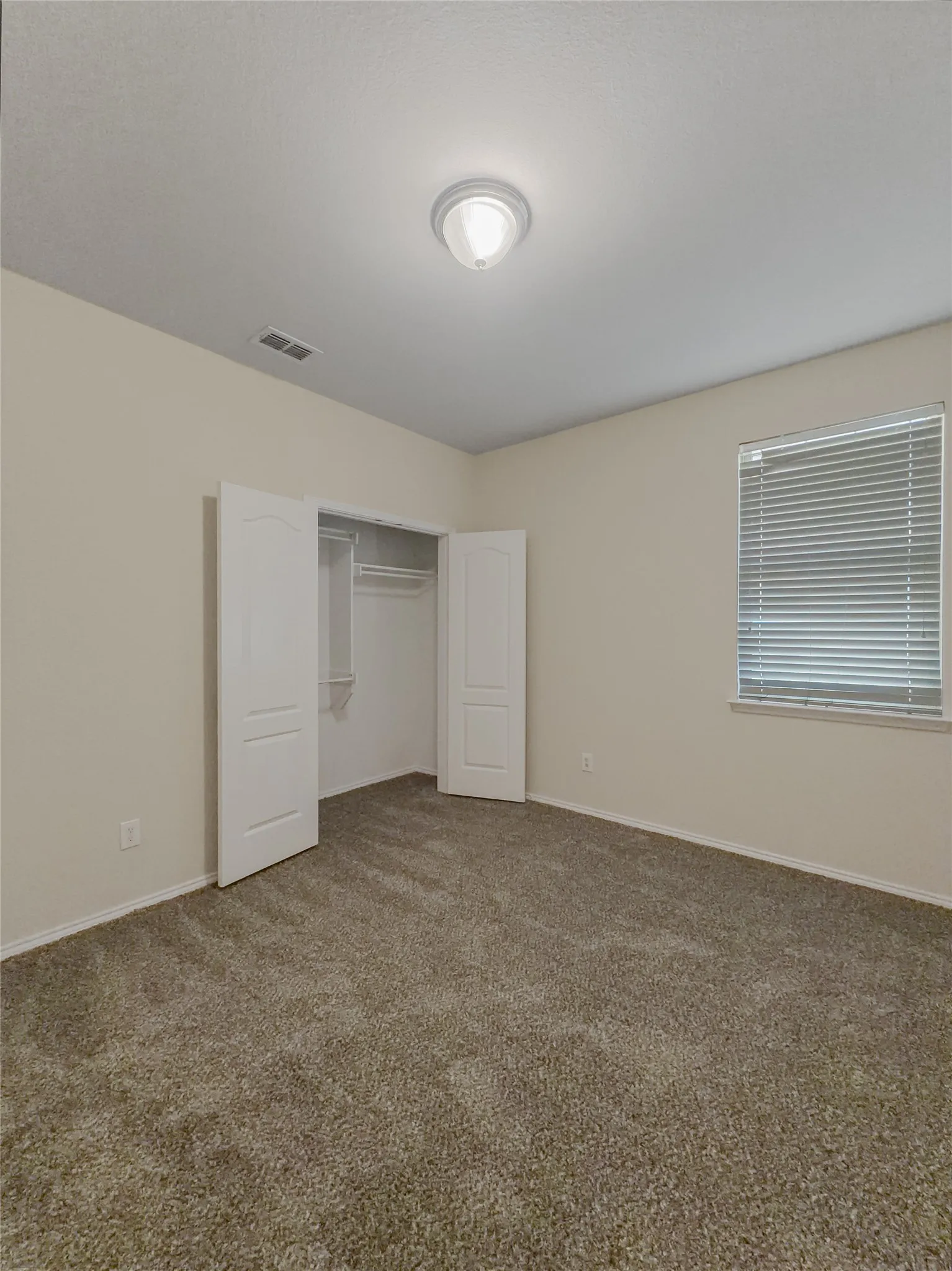 Wall-to-wall carpeting with neutral wall tones