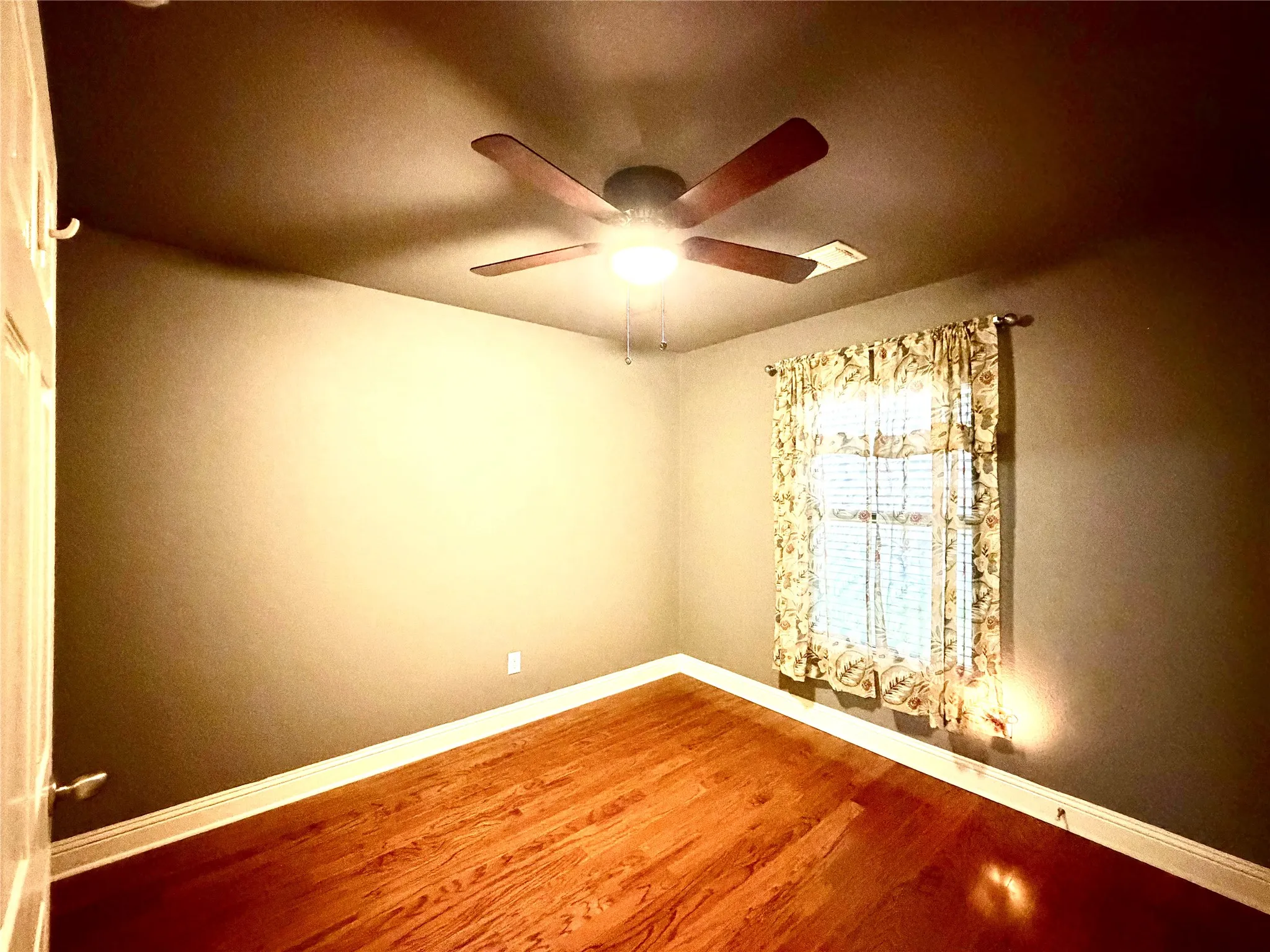 Wood-finish flooring with baseboard trim