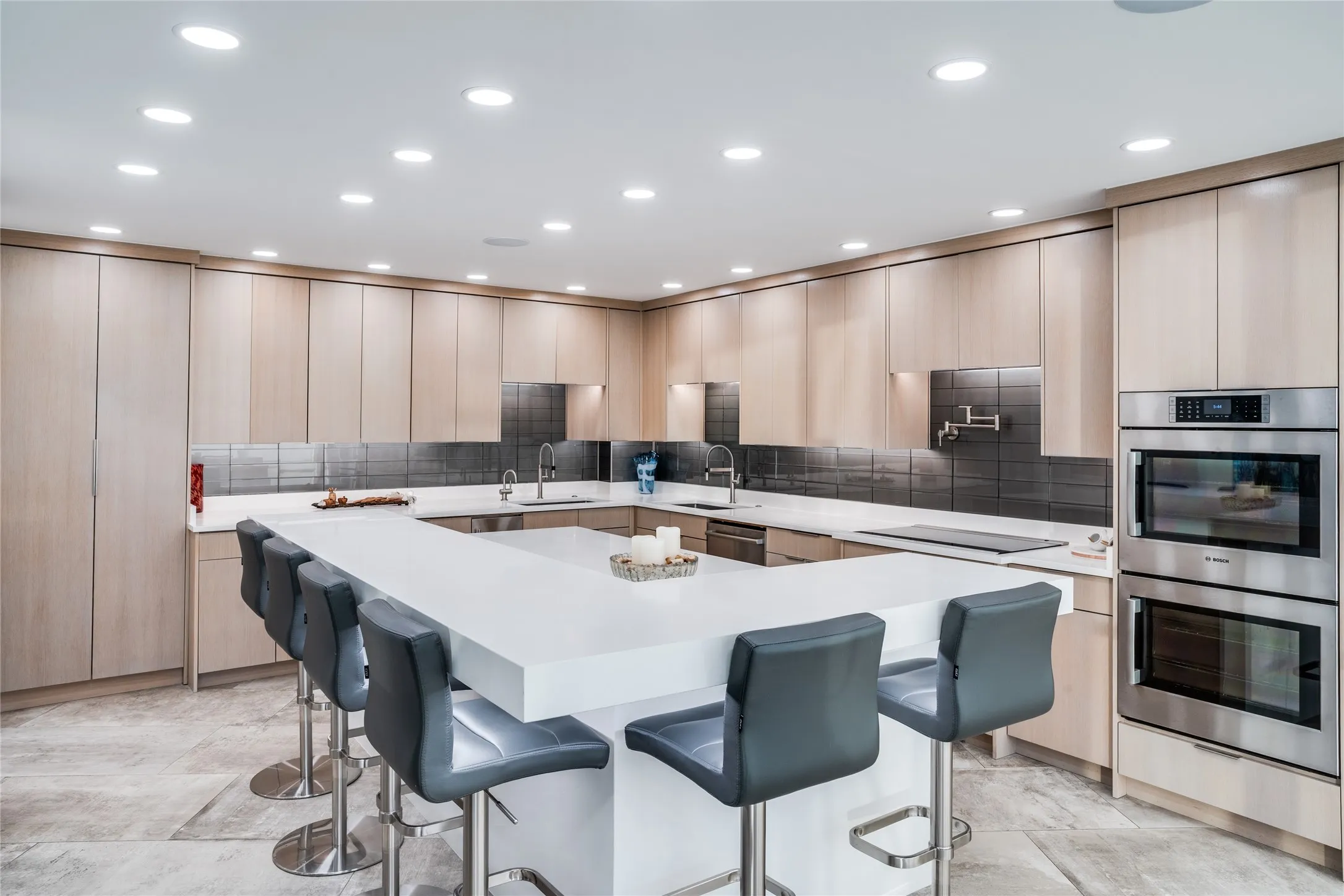 Kitchen has an oversized island and Bosch appliances