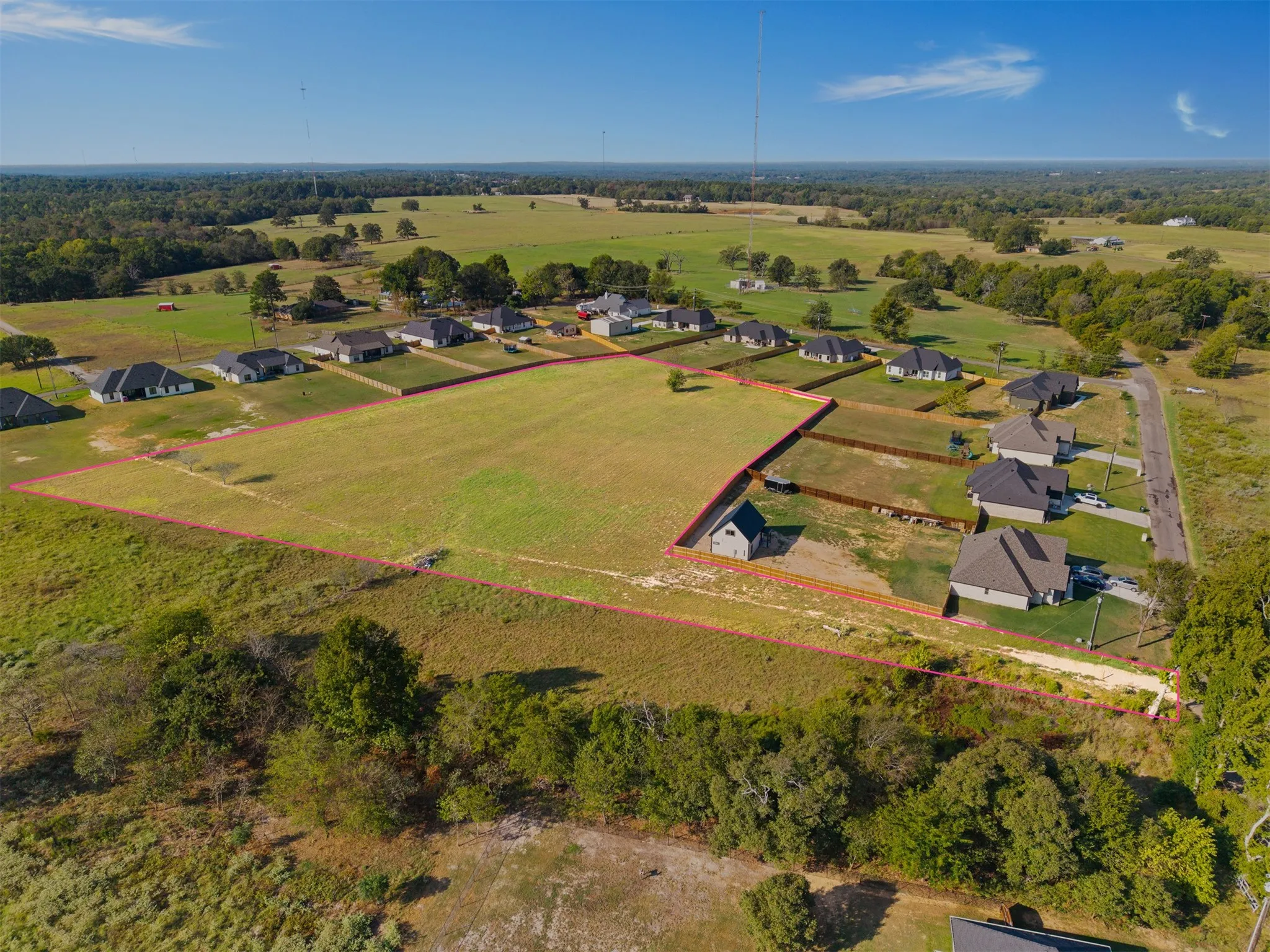 Expansive land parcel featuring clear boundaries, surrounded by established residential properties