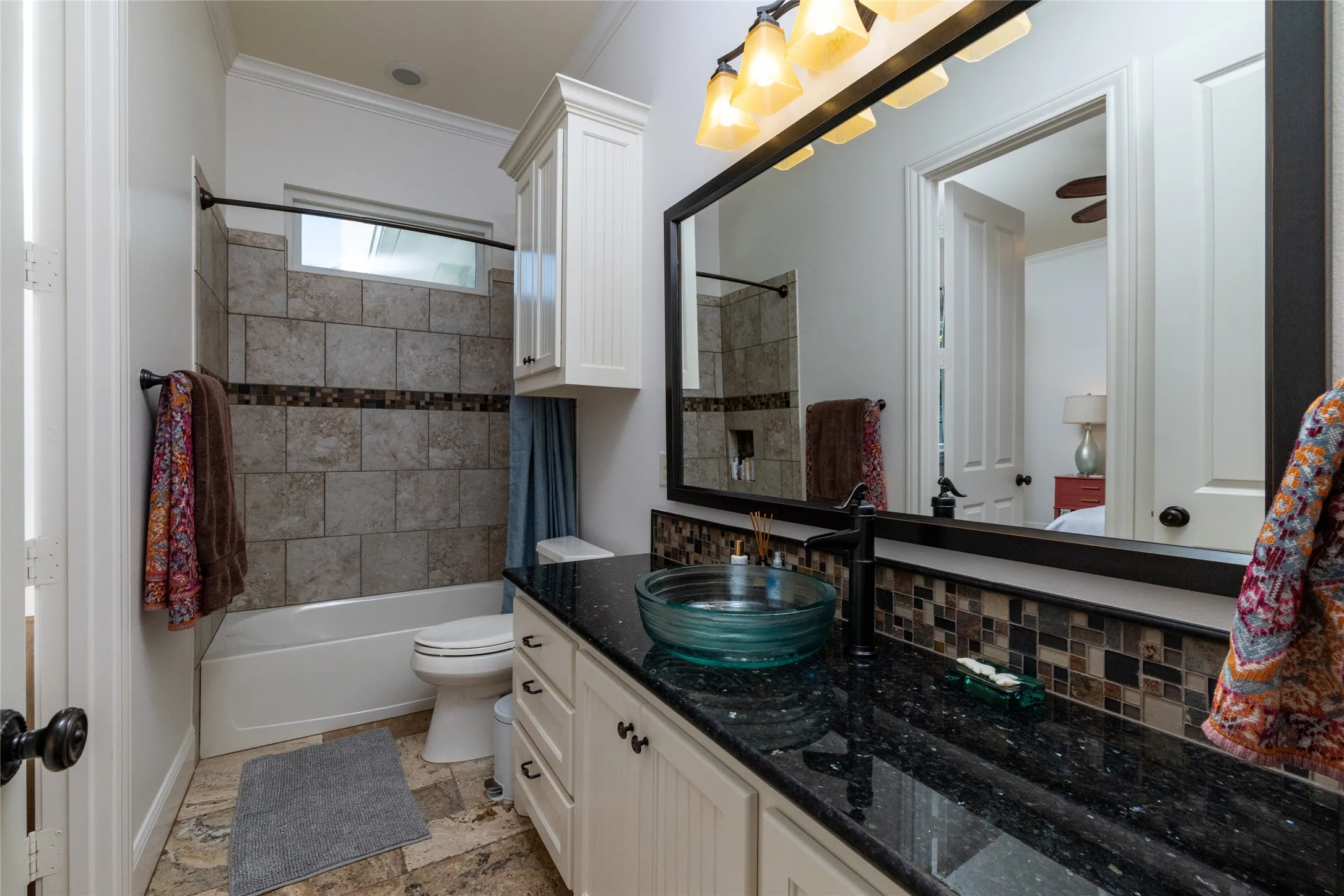 Tub-shower combination with tile surround and decorative accent band