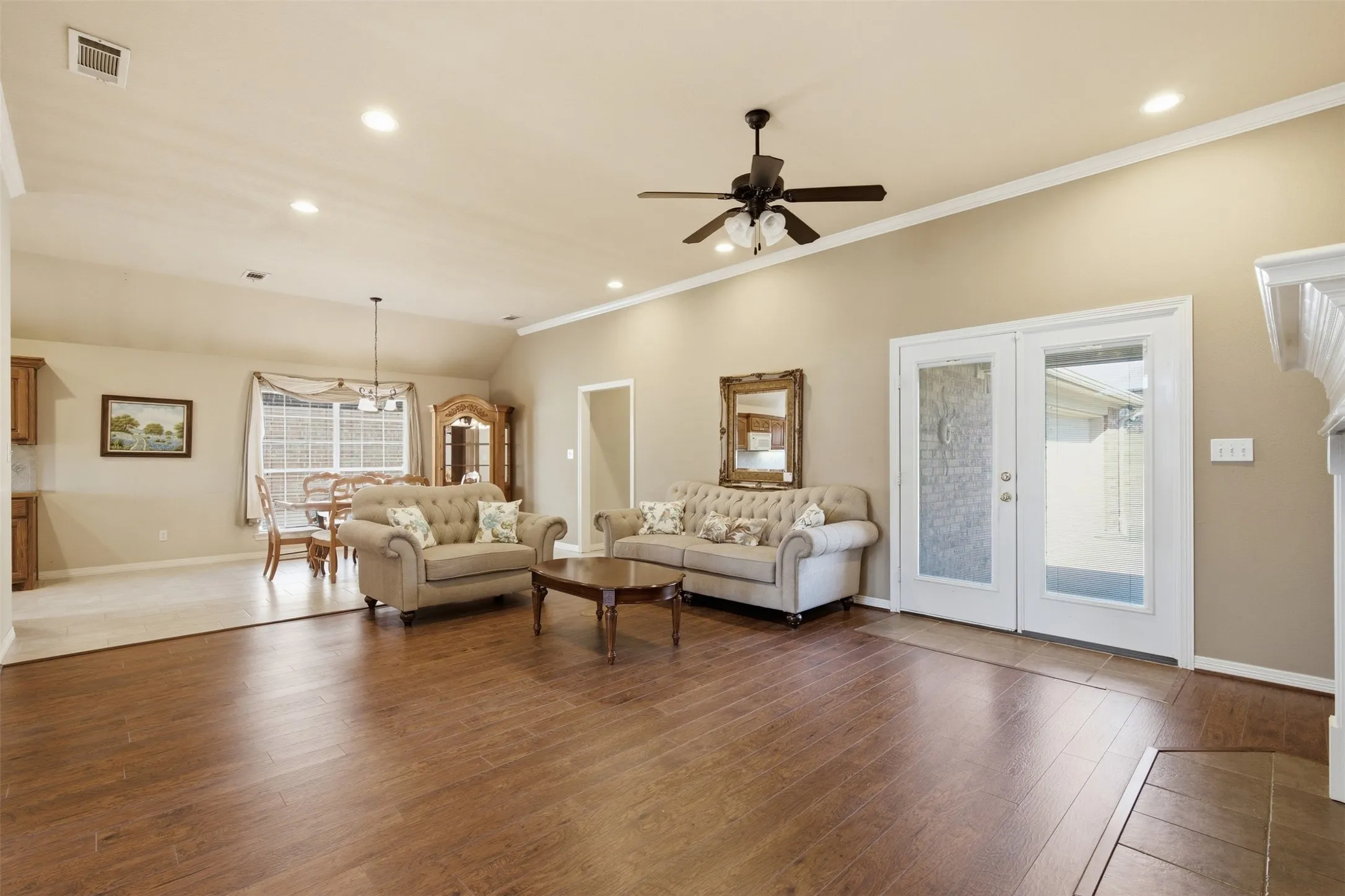 LIVING ROOM OVERLOOKS SPACIOUS DINING AREA