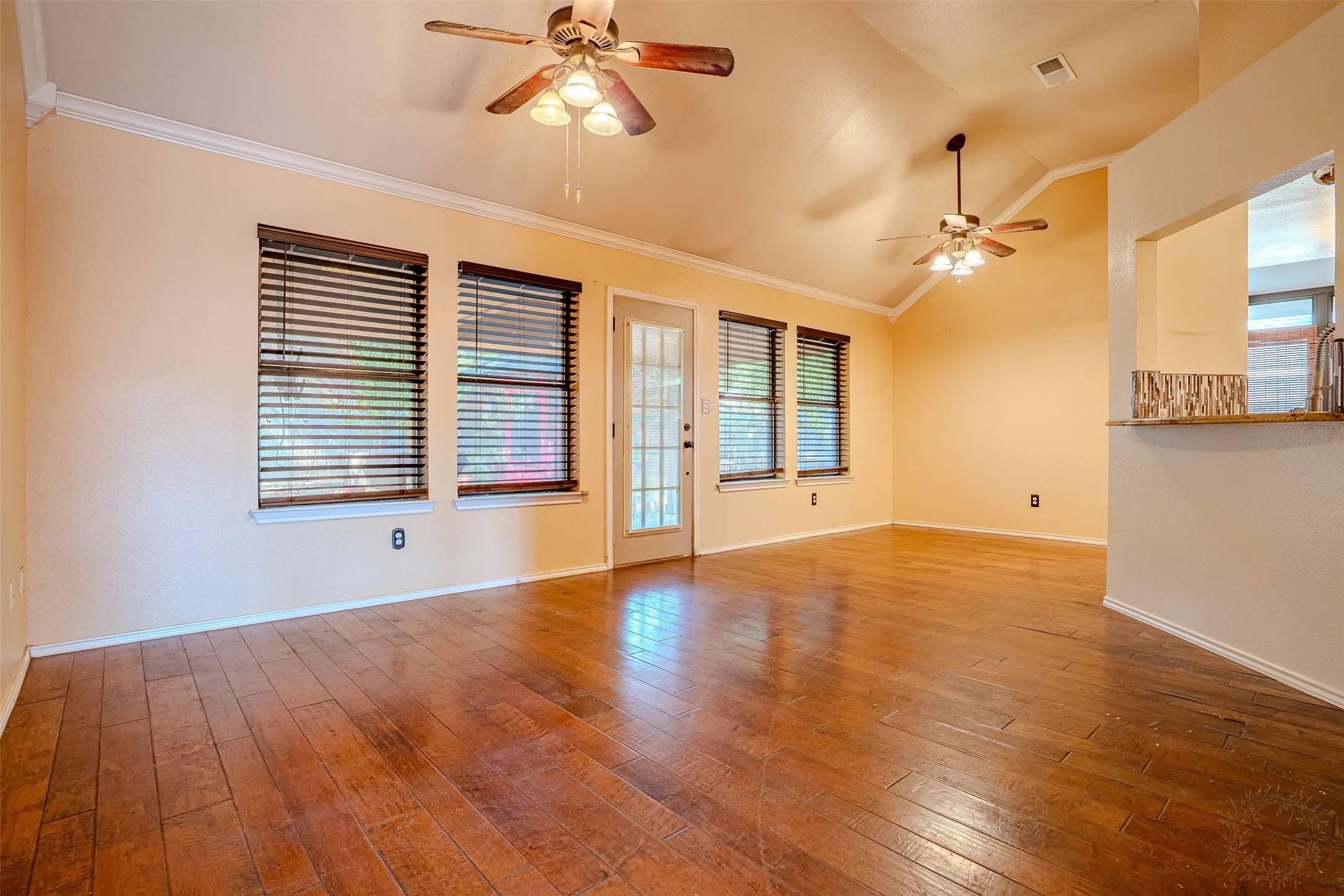 Beautiful wood floors in living area and cut through to kitchen