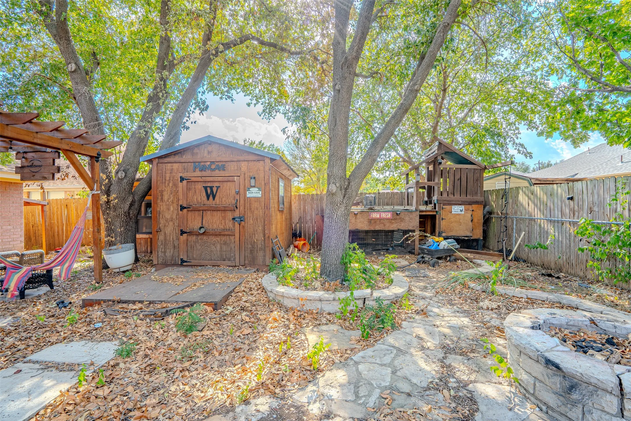 Storage building, play area with chicken coop below