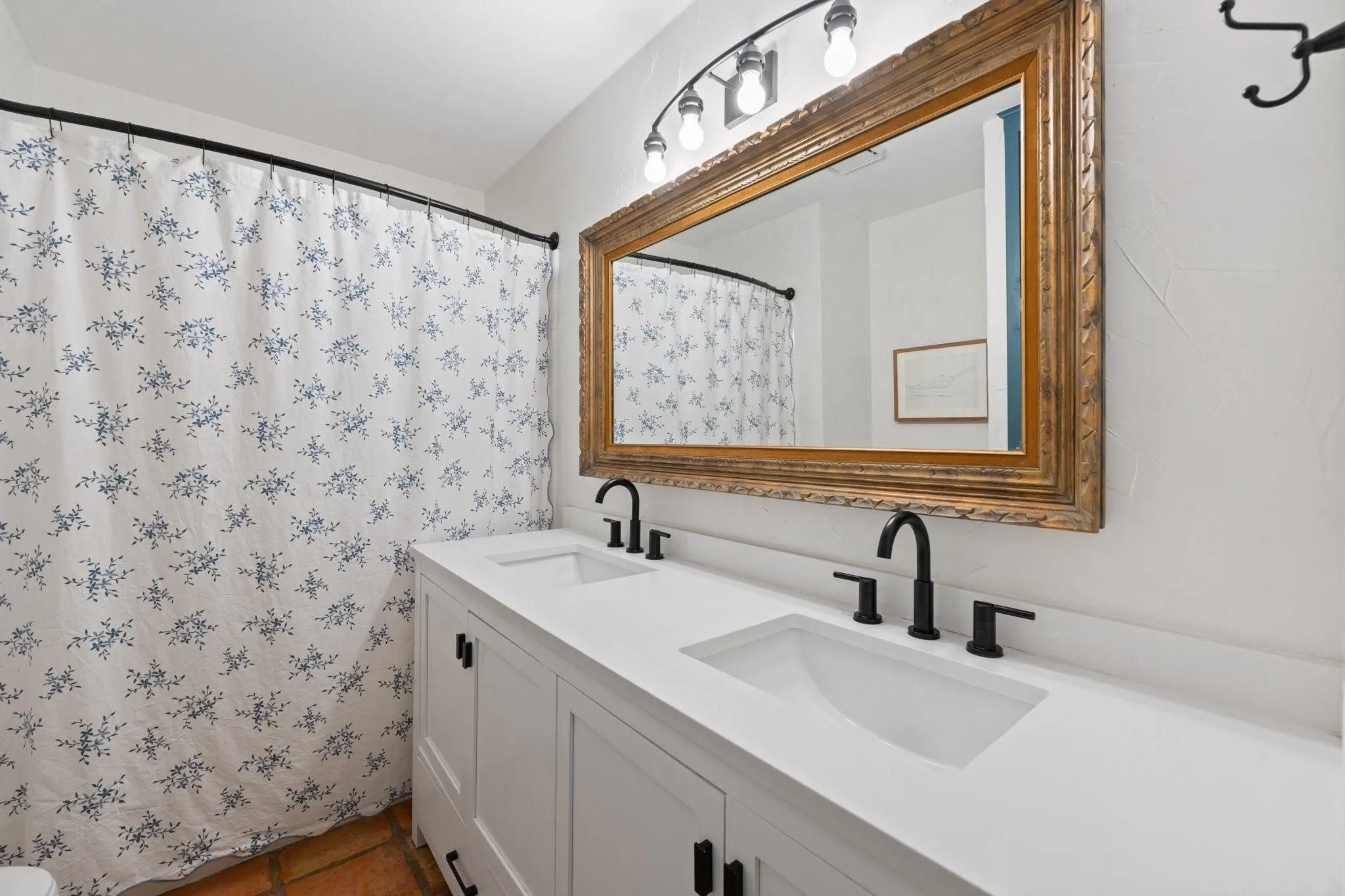 Guest bathroom, conveniently located down the hall near the living room and across from the guest bedrooms.