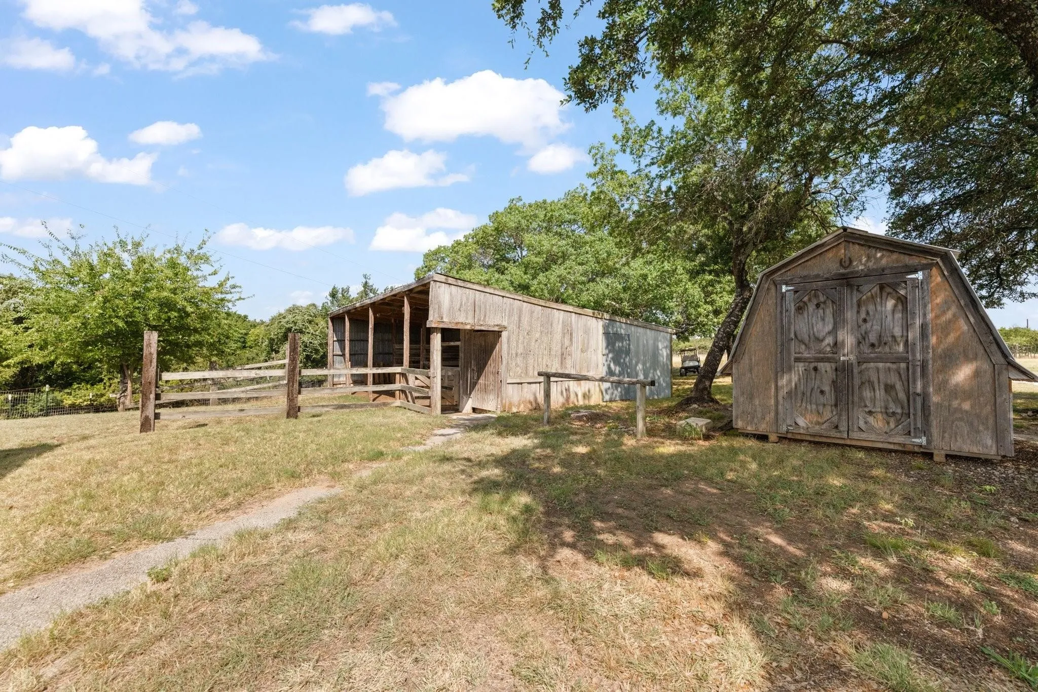 A TIE RACK and a 2ND STORAGE SHED are conveniently located next to the barn.