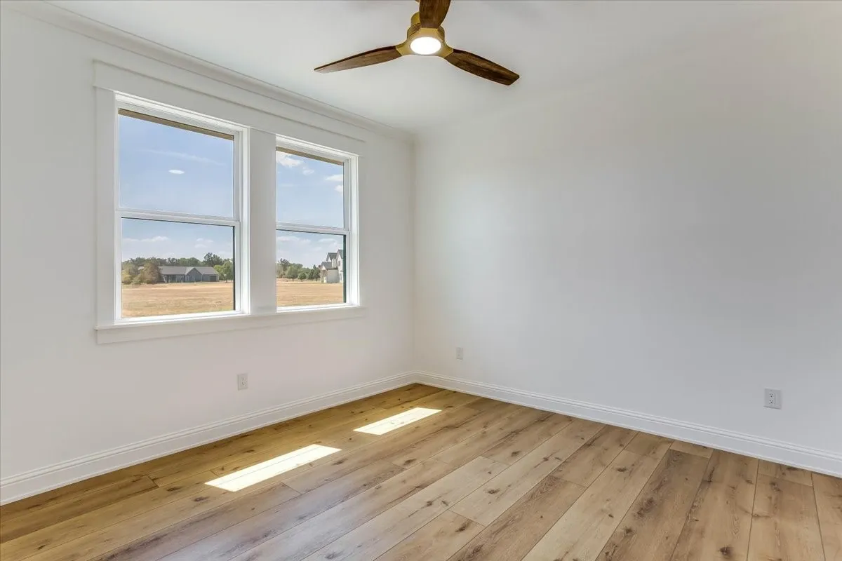 Dual pane windows, wood-finish flooring, white trim, recessed lighting, and a ceiling fan