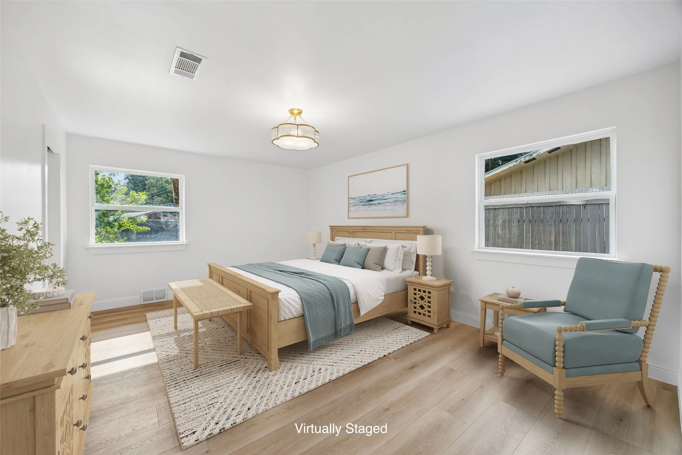 The primary suite checks every box. Spa like ensuite bath, walk in closet, and light pouring in from two sides.