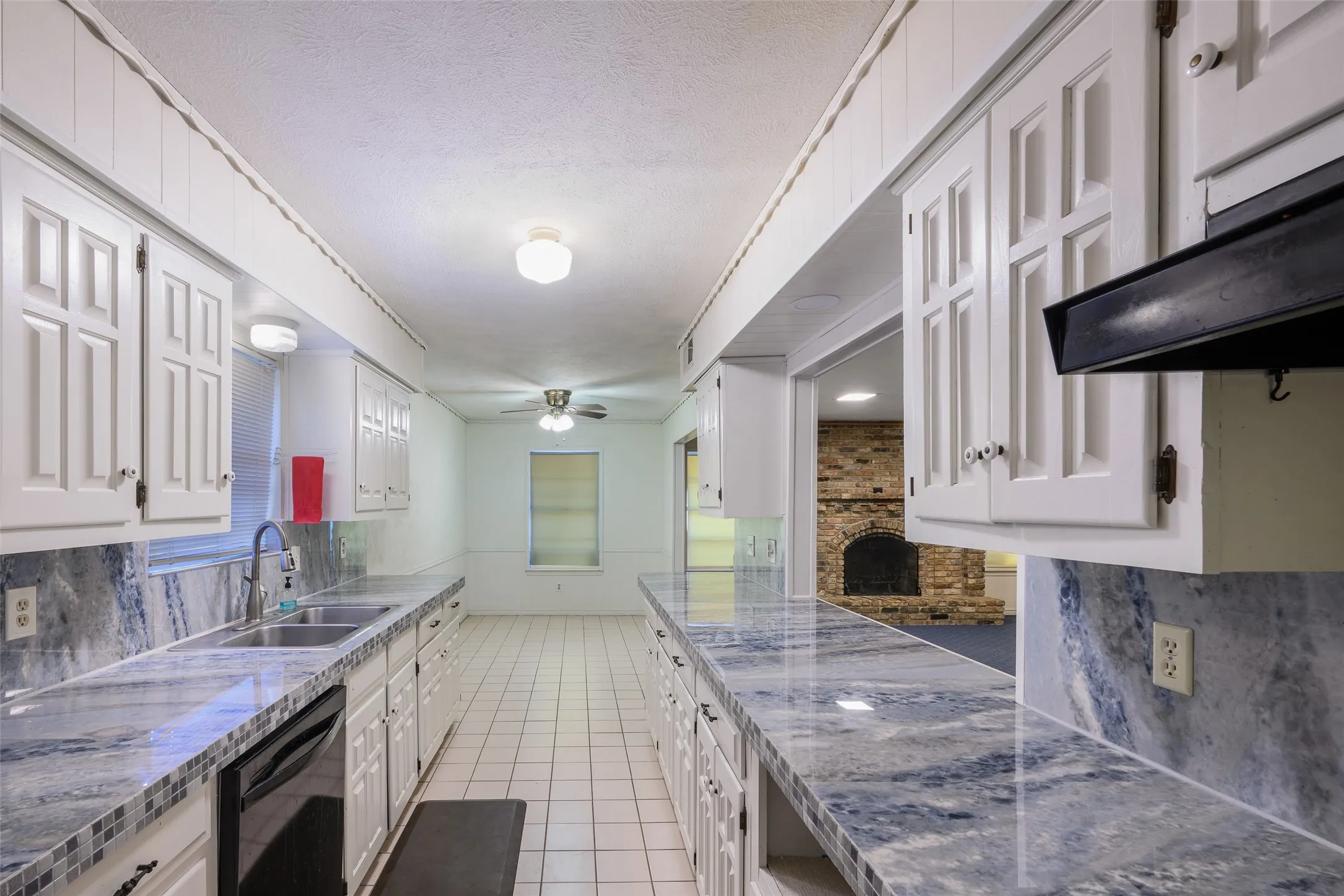 White cabinetry with decorative paneling
