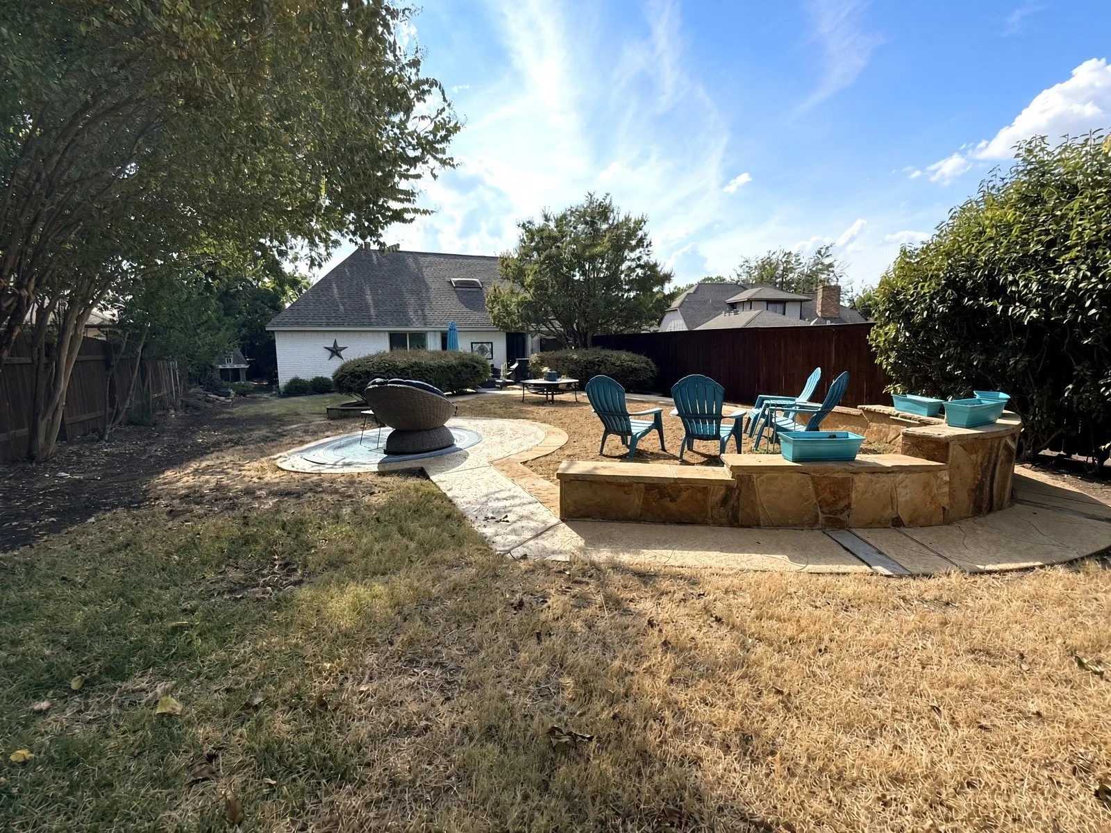 large back yard, well landscaped, and long driveway to park extra cars too!