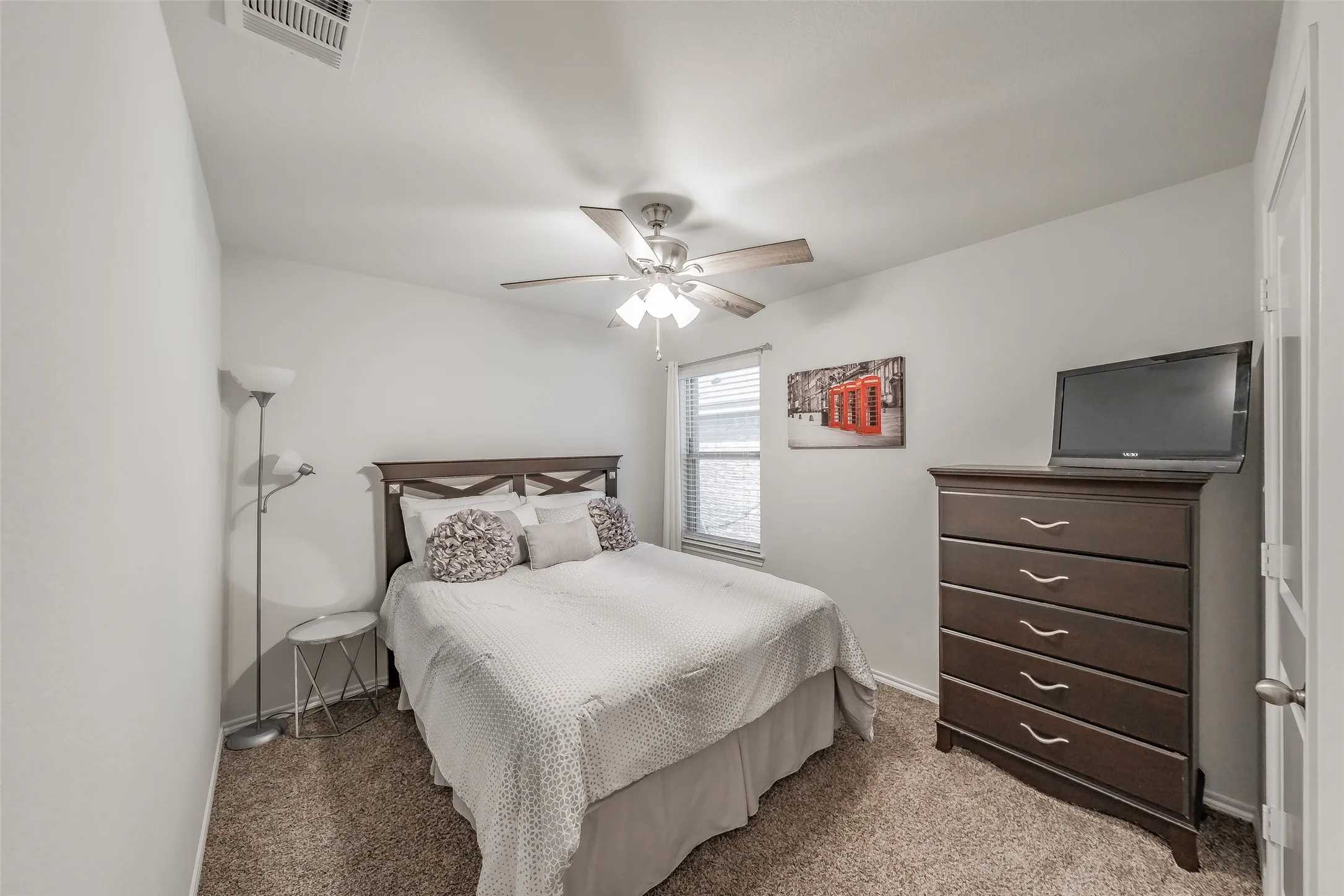 Recessed ceiling fan, textured wall finish, and window with blinds