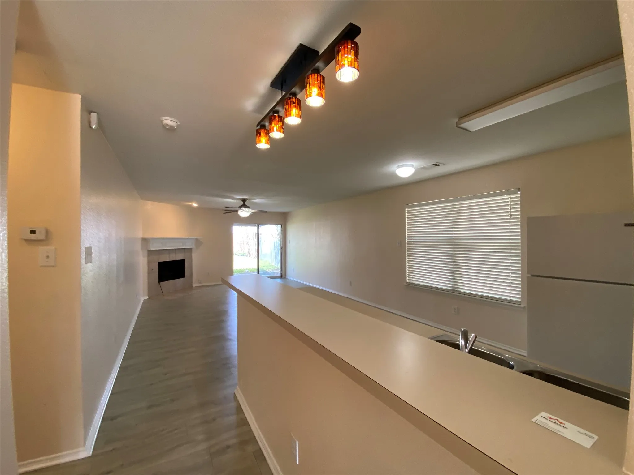 Hallway with baseboards and dark wood finished floors