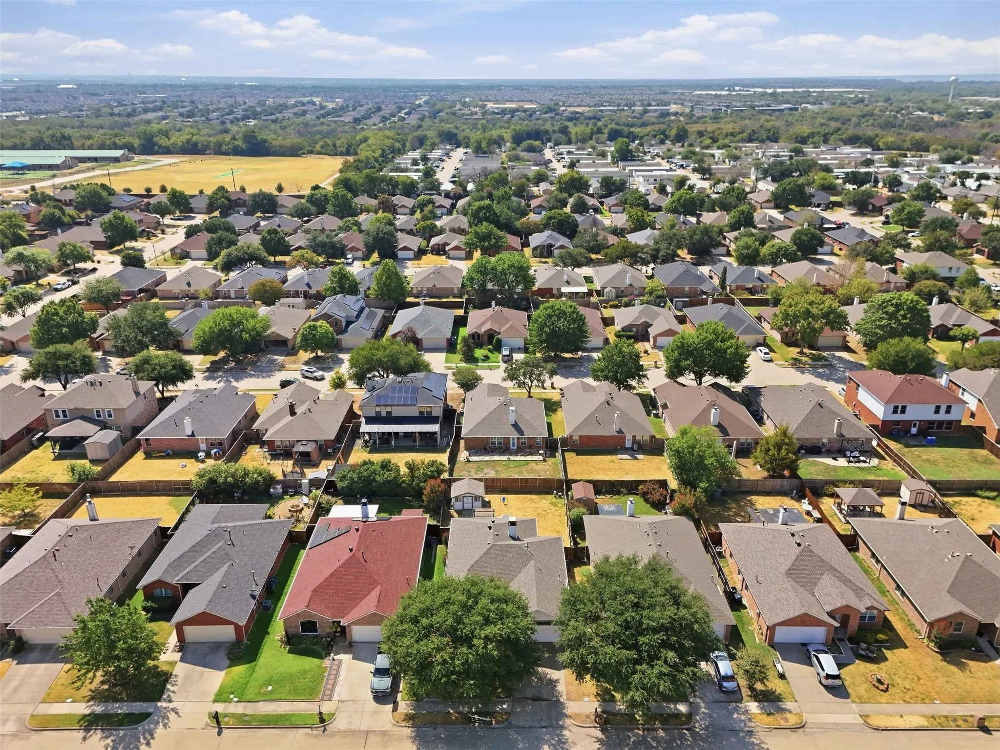 Expansive residential neighborhood with mature trees and varied architectural styles