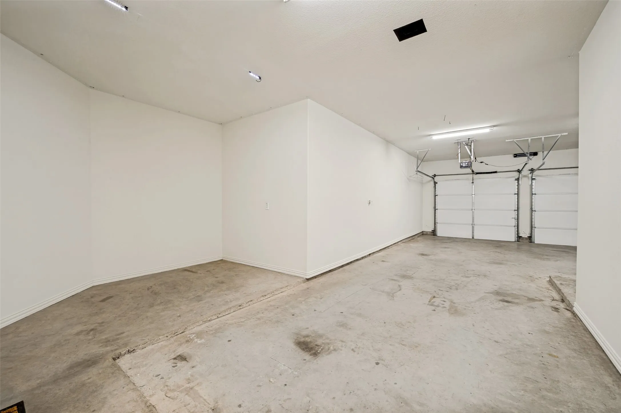 oversized 3 car tandem garage with room for golf cart or workbench