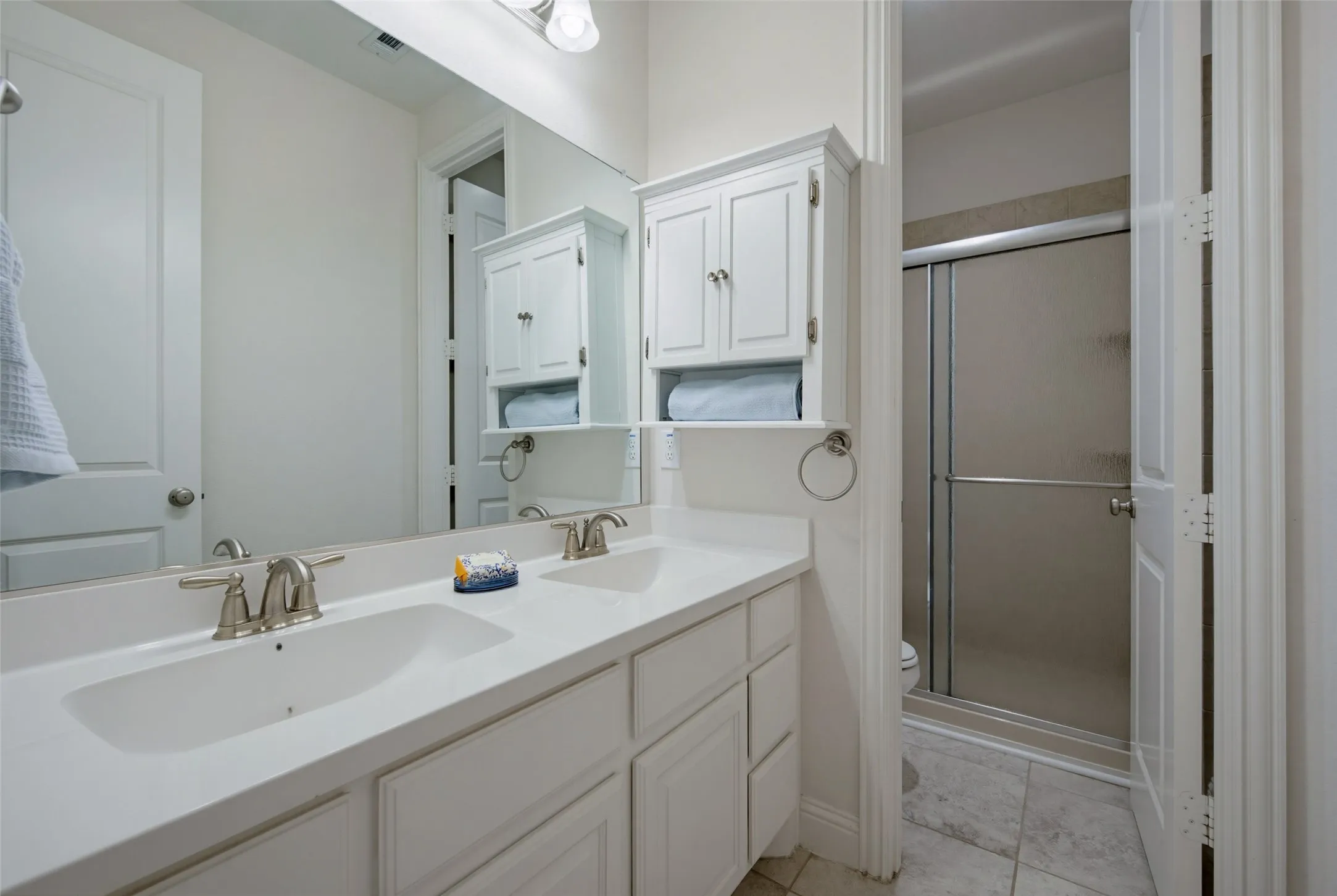 Bath with dual sinks and private bath with shower