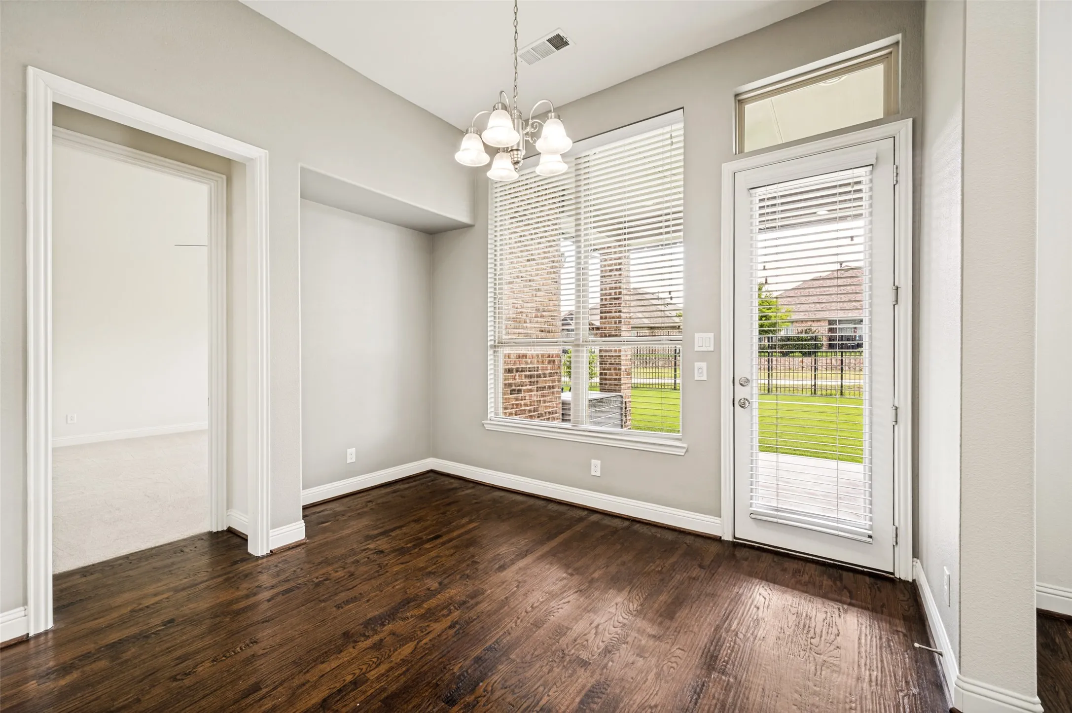 Breakfast room overlooking patio and backyard