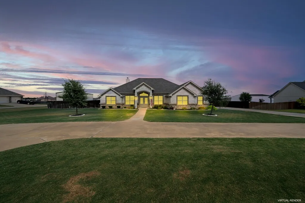 Exterior featuring stone and siding, a covered entry, established landscaping, and a concrete drive