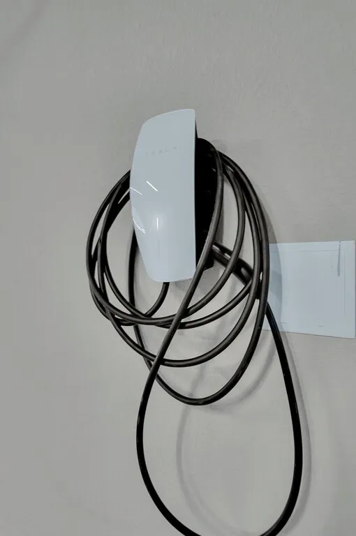 Wall-mounted electric vehicle charging station