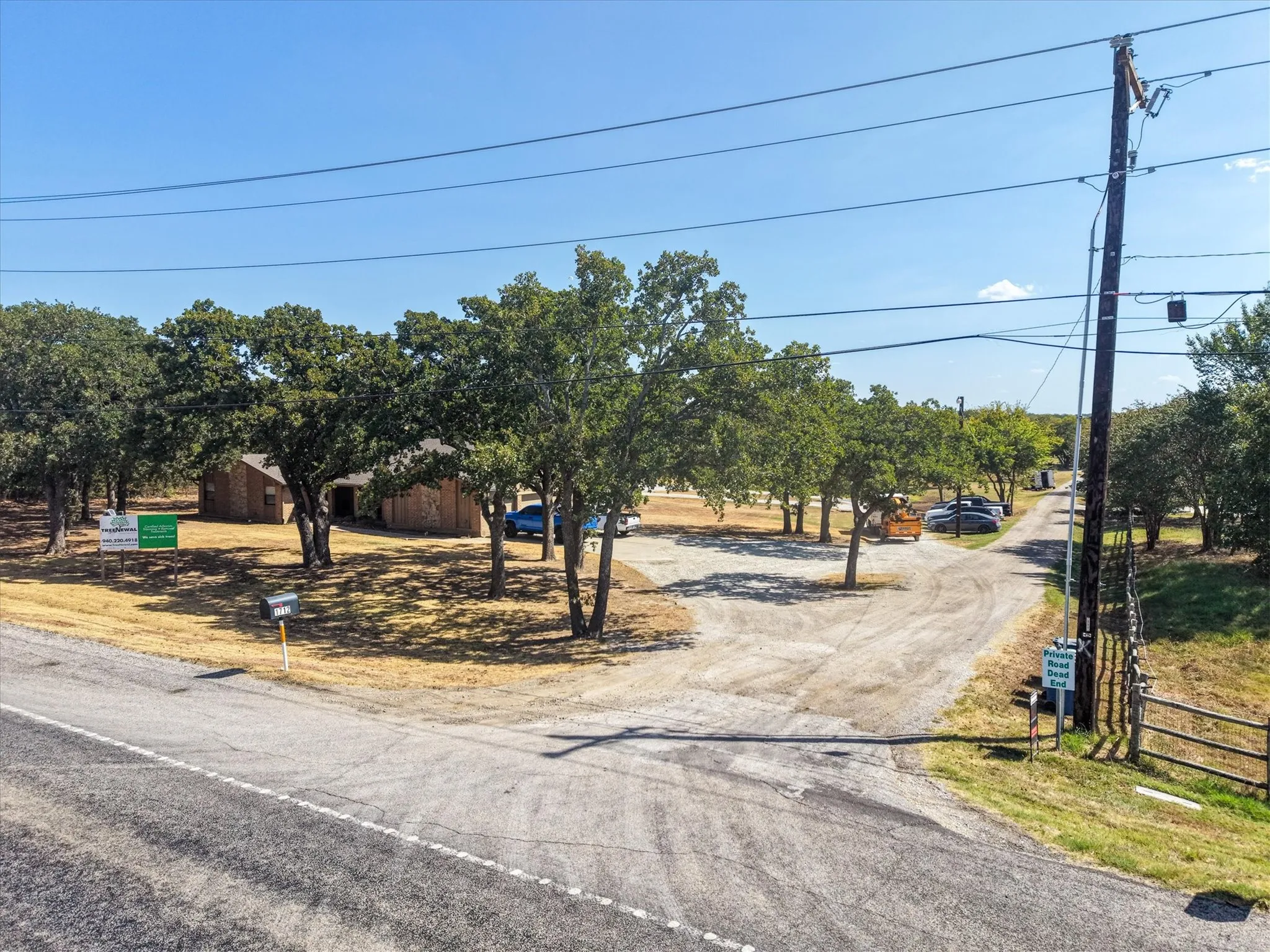 Property entrance and driveway access directly from FM 407.