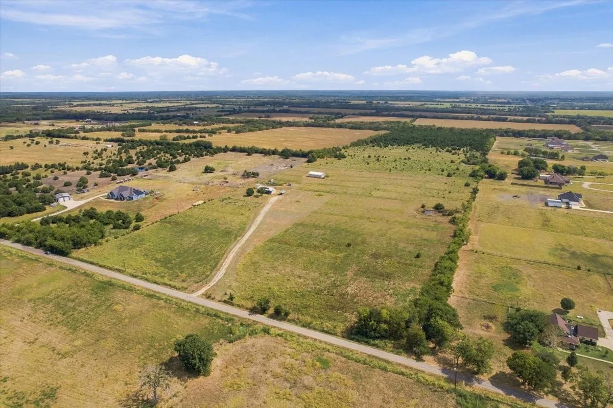 Aerial view of property (land to right of driveway is not included in this listing but is also available (see MLS#20986552)