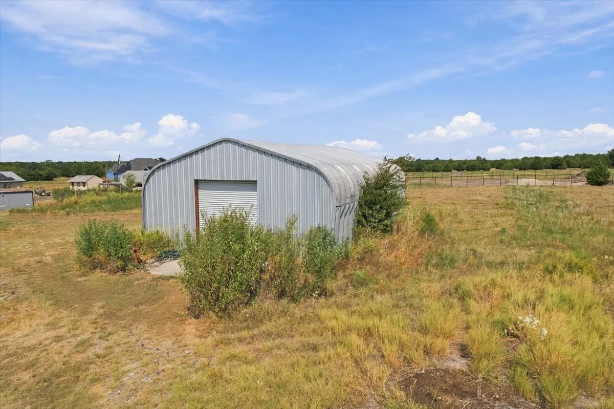 30X50 Metal shop w concrete slab, RU door, exterior back door