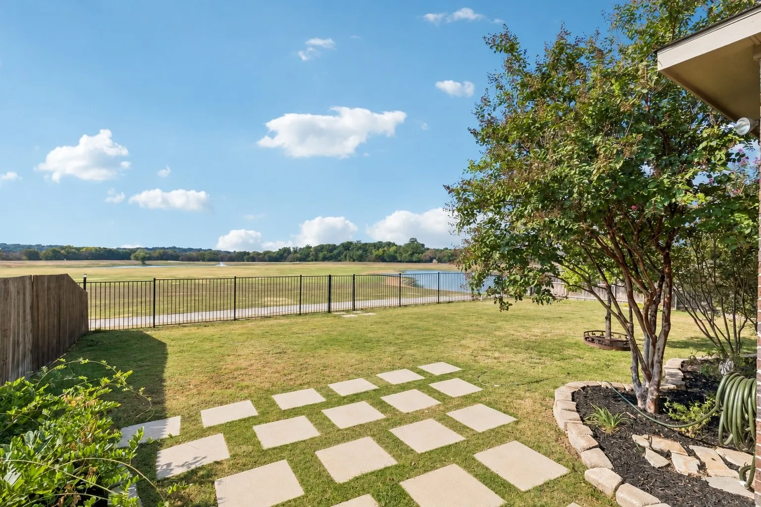 Expansive lawn with stepping stone pathway