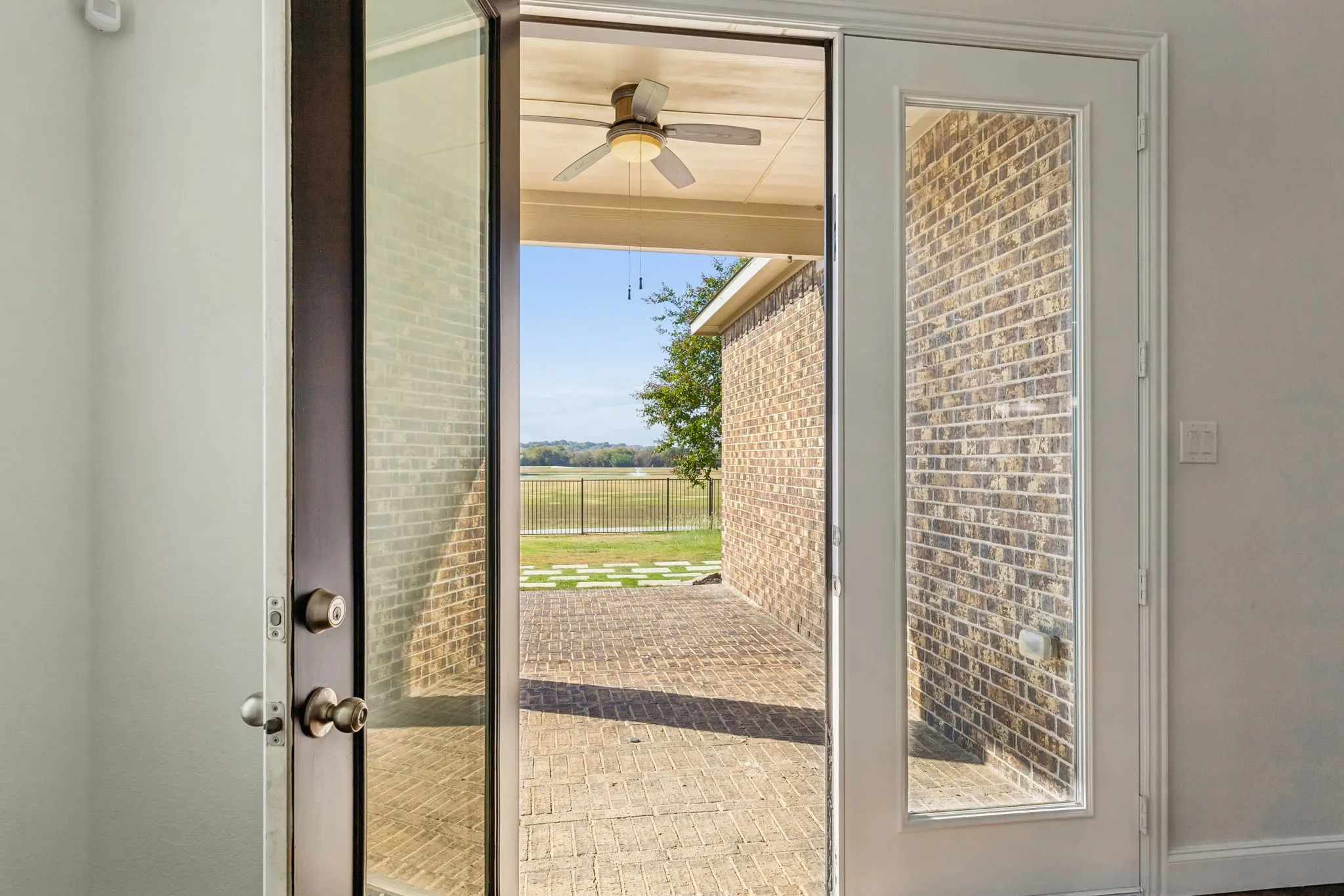 Patio access through glass-paneled double doors