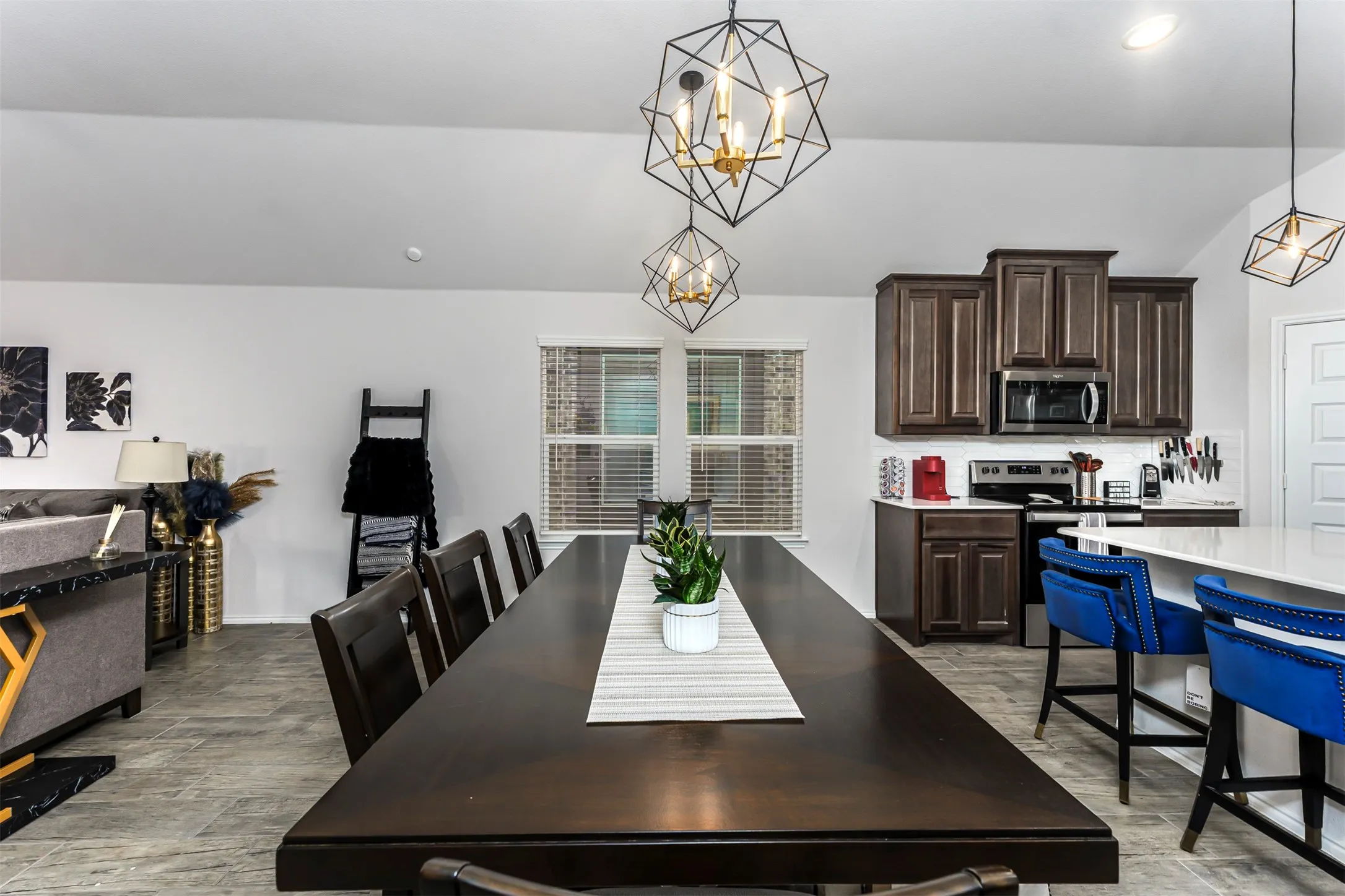 Vaulted ceilings with geometric pendant lighting
