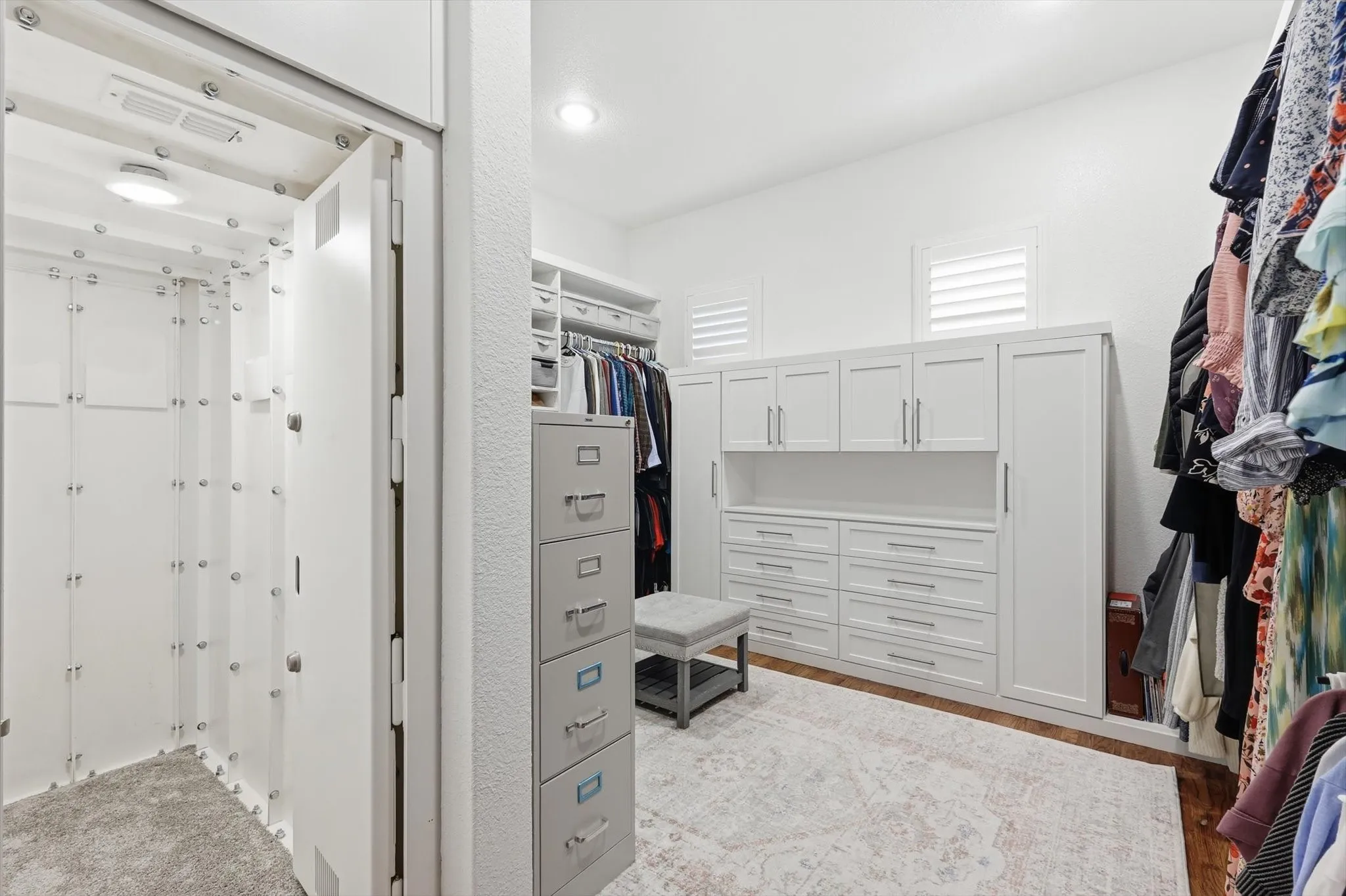 Built-in custom cabinetry, integrated shelving, and recessed lighting