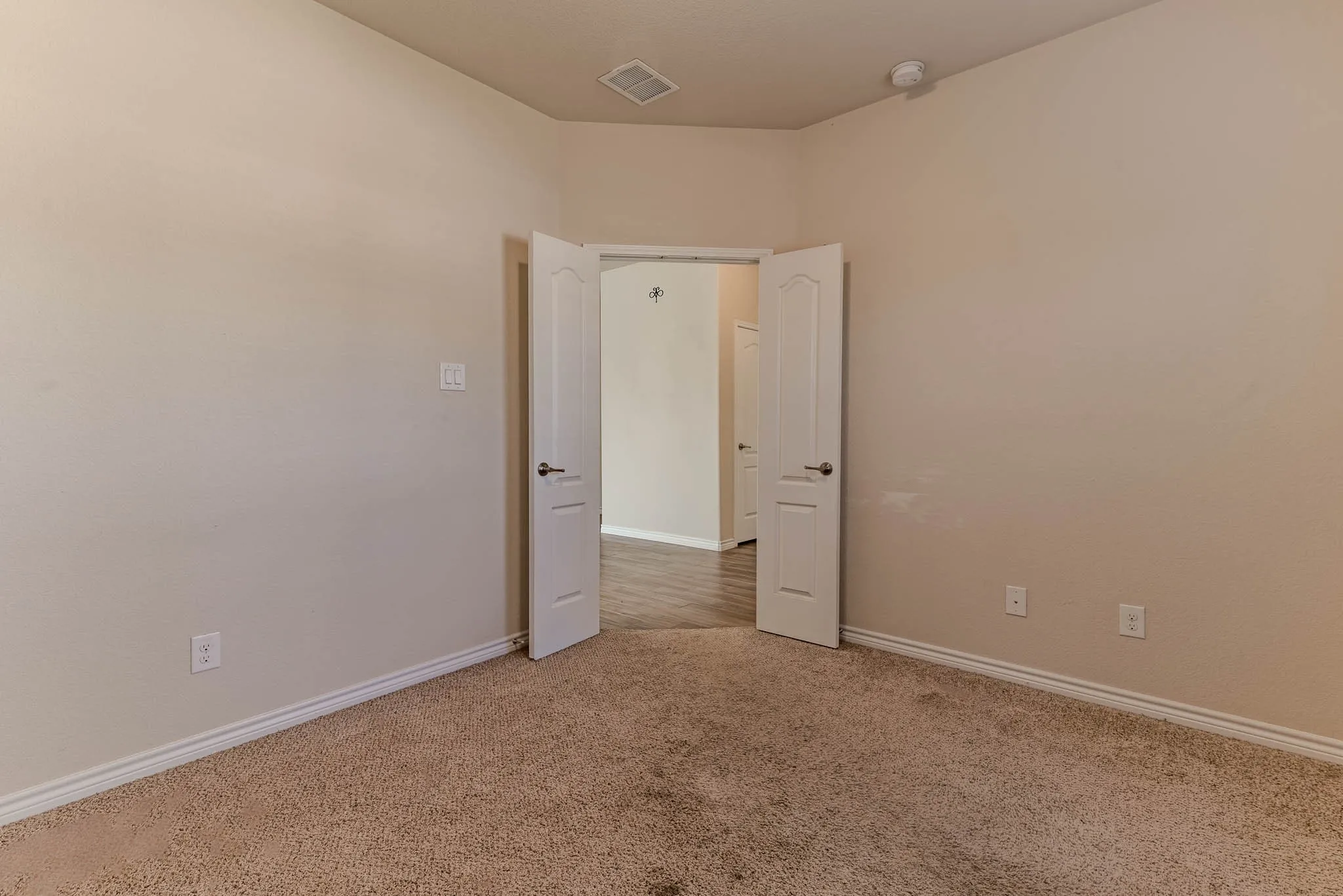 Front office with carpet and double wooden doors