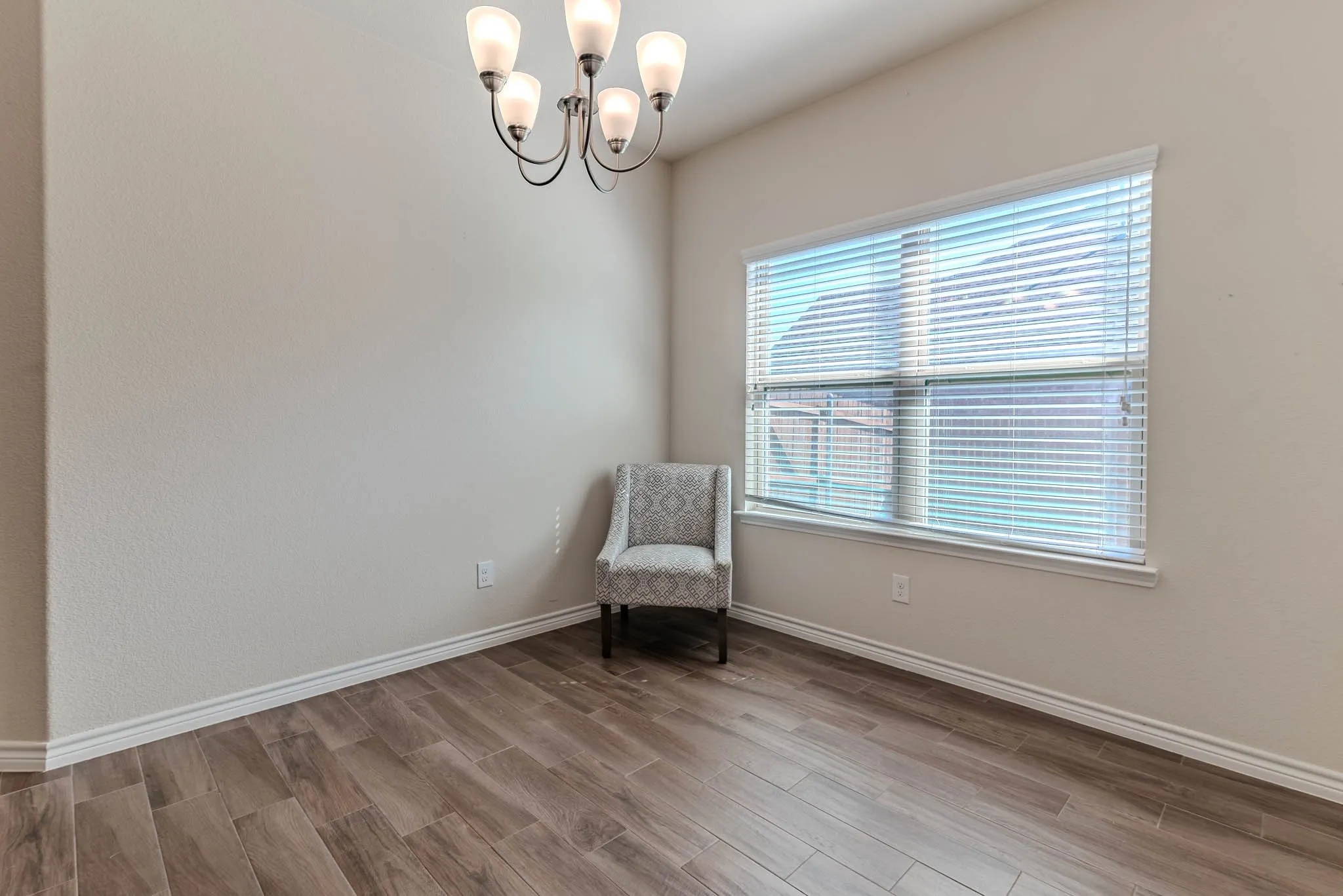 Sitting or dining area with wood-type flooring
