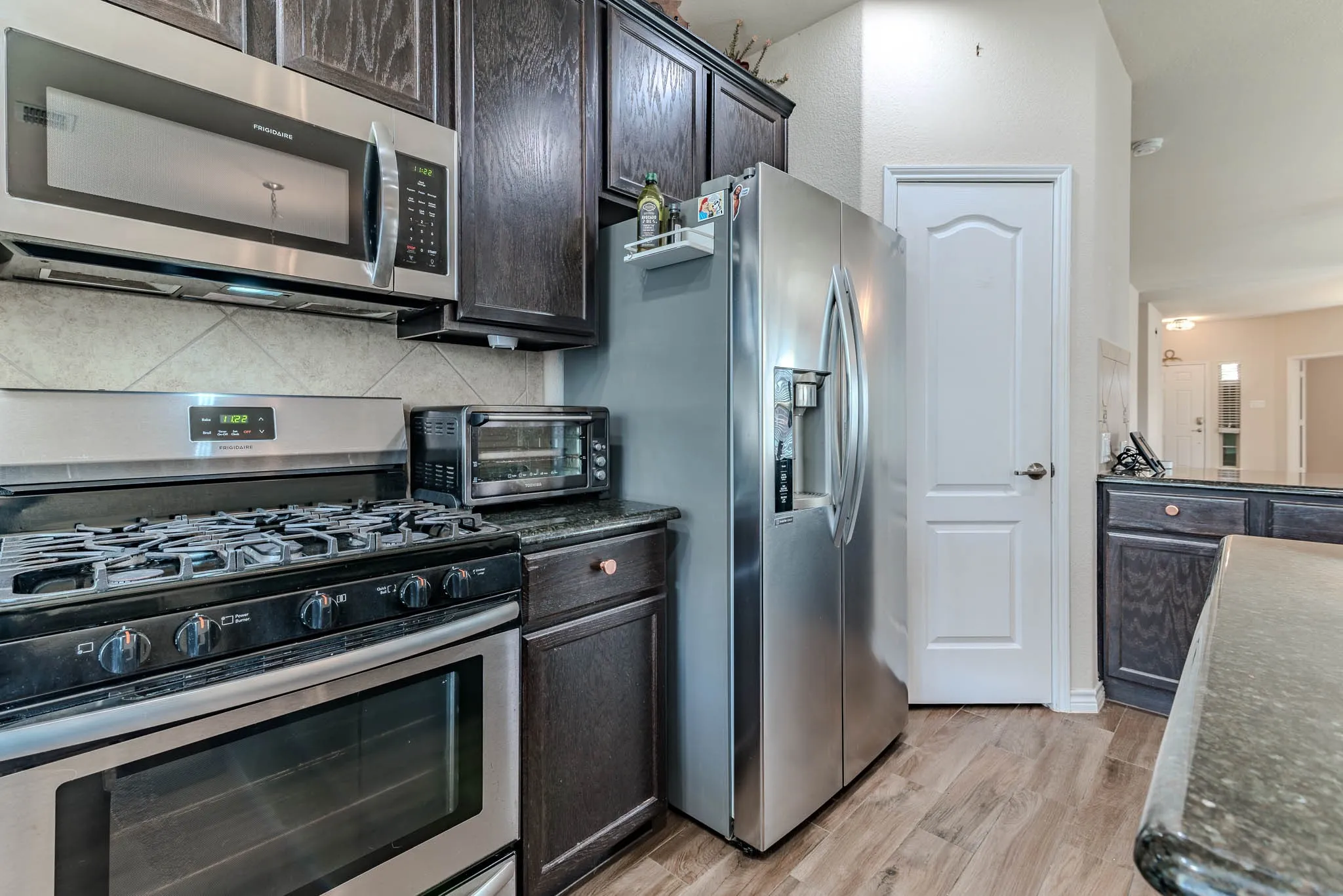 Kitchen with gas range and stainless steel  appliances