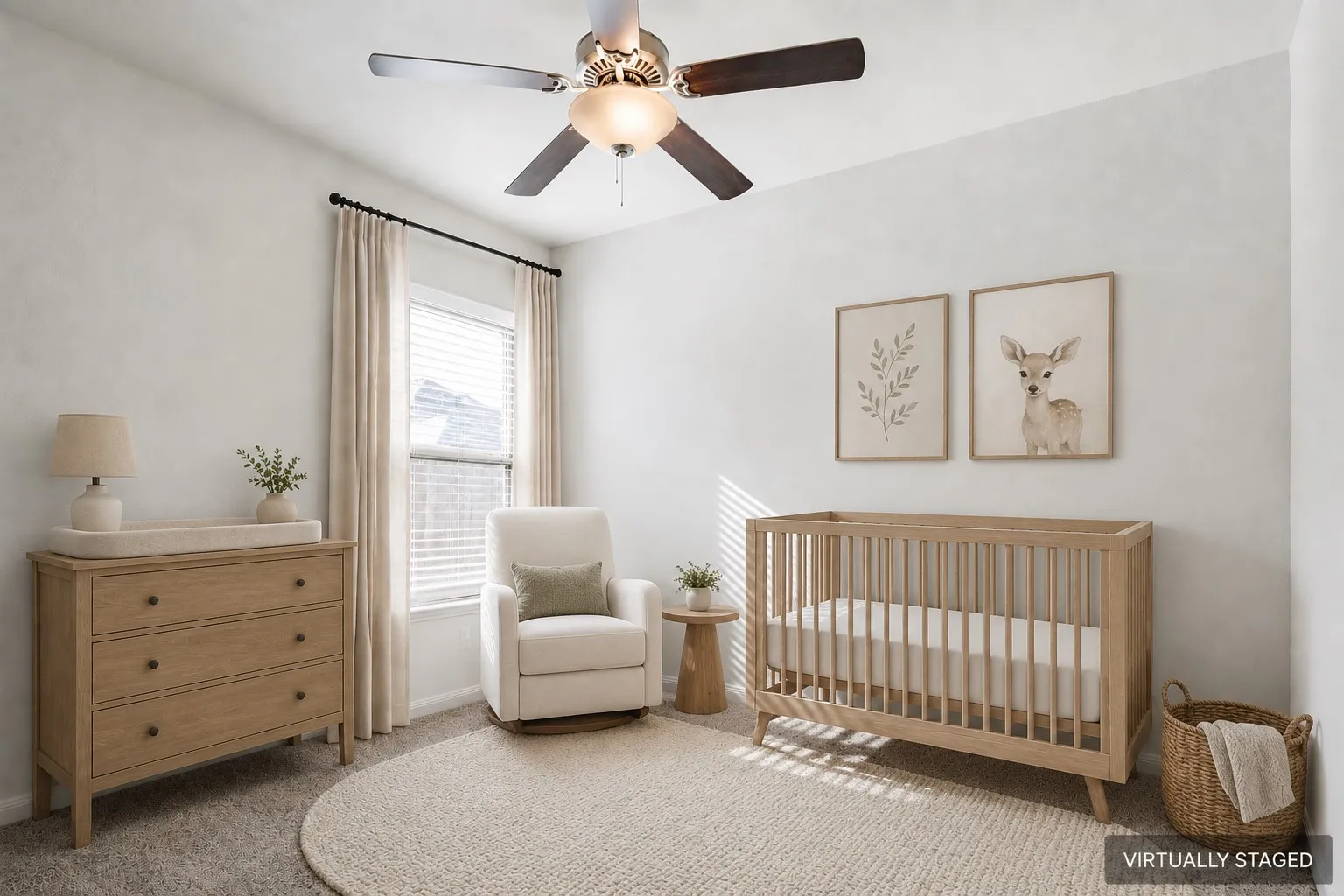 Virtually Staged. 2nd of two secondary bedrooms staged as a nursery. Ceiling fan with integrated lighting
