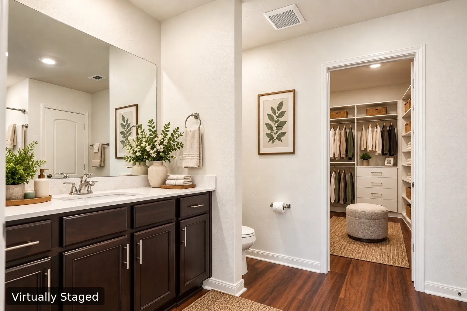 Virtually Staged. Dual-sink vanity with dark wood-finish cabinetry, a large wall-mounted mirror, and wood-finish LVP flooring