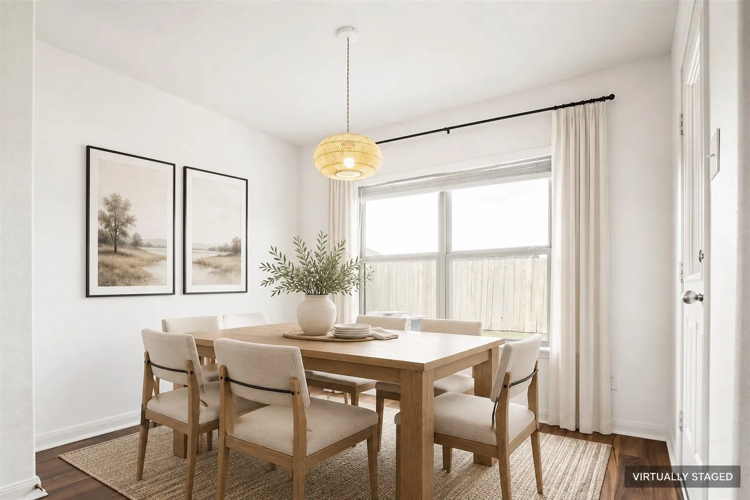 Virtually Staged dining area. Recessed window with full-height drapes, wood-finish LVP  flooring, and a contemporary pendant light fixture