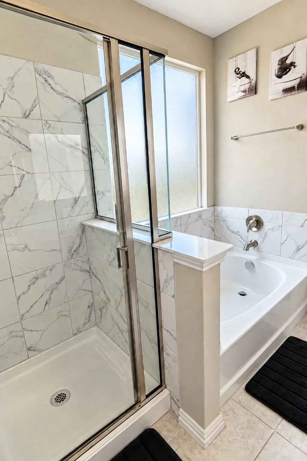 Master Bathroom featuring a glass-enclosed shower, built-in bathtub, and marble-look tile surround