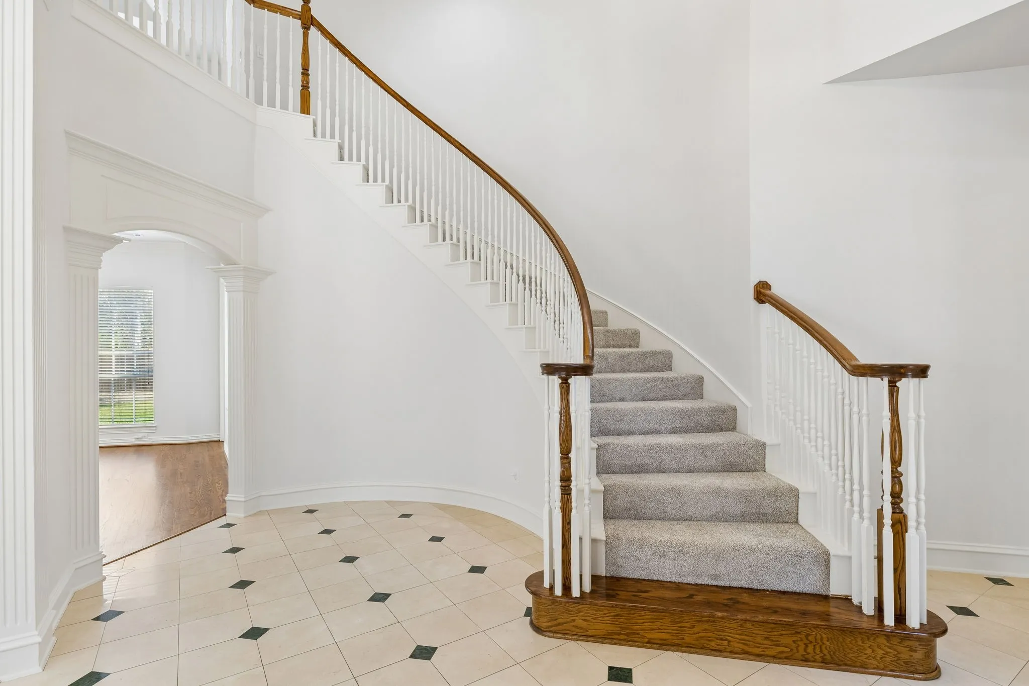 Beautiful staircase greets you at the front door.