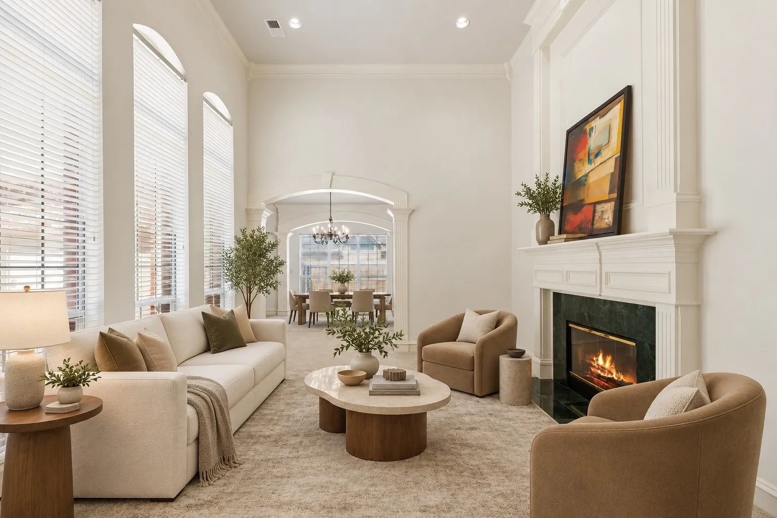 In the living/dining space you'll love all the natural light coming in from the windows - beautiful high ceilings and gorgeous crown molding - and cozy fireplace. (This photo is virtually staged.)