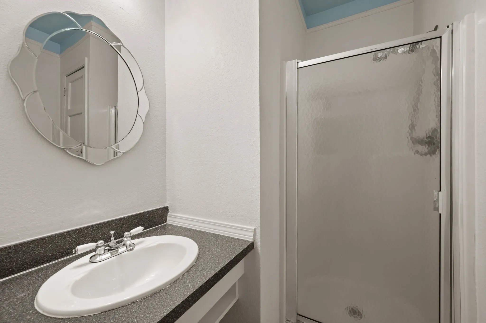 Full bathroom featuring vanity and a stall shower