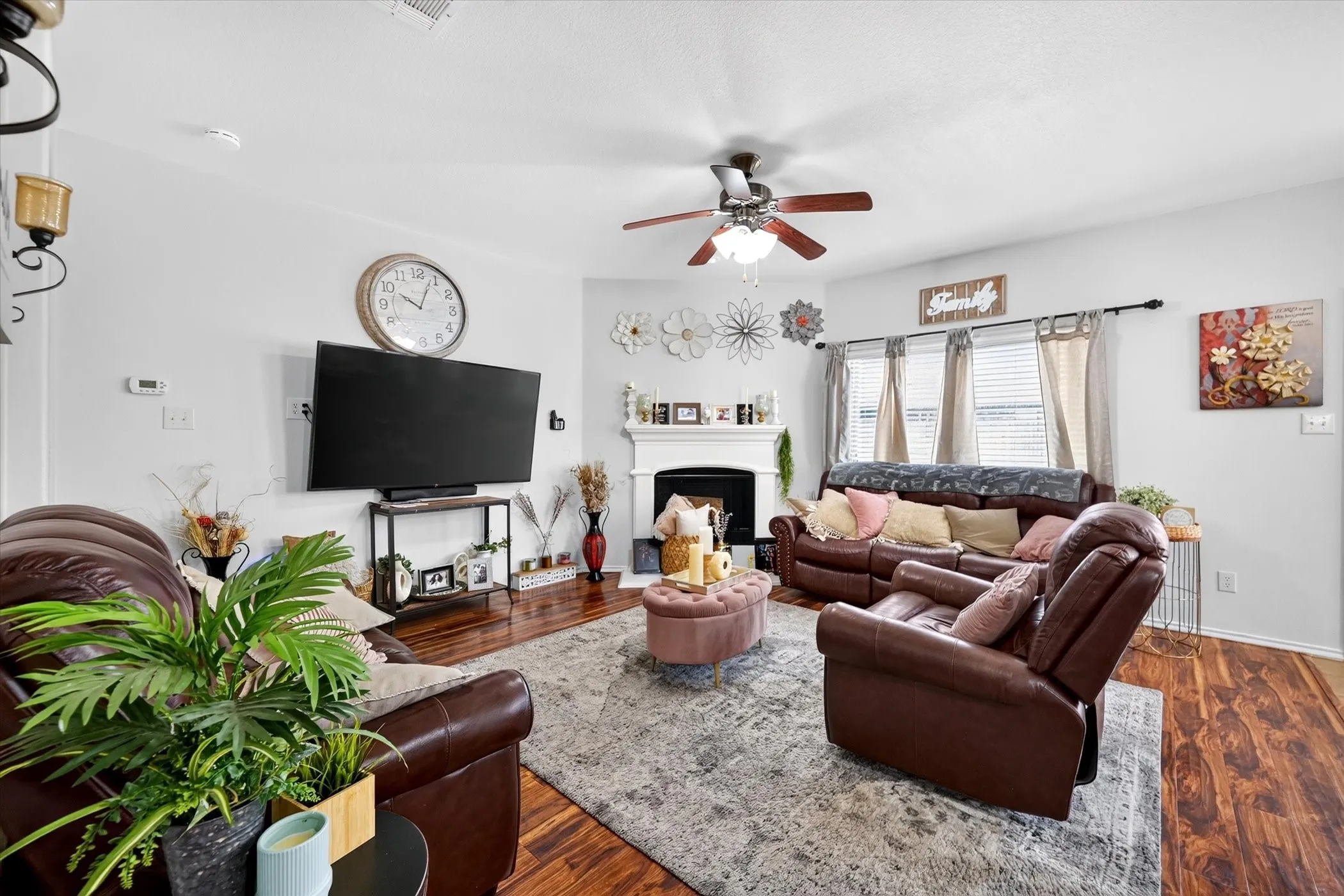 Wood-finish flooring throughout, complemented by light-colored walls