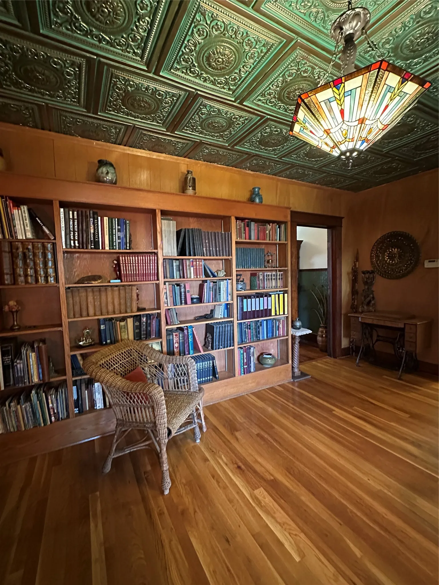 Ornate green pressed-tin ceiling